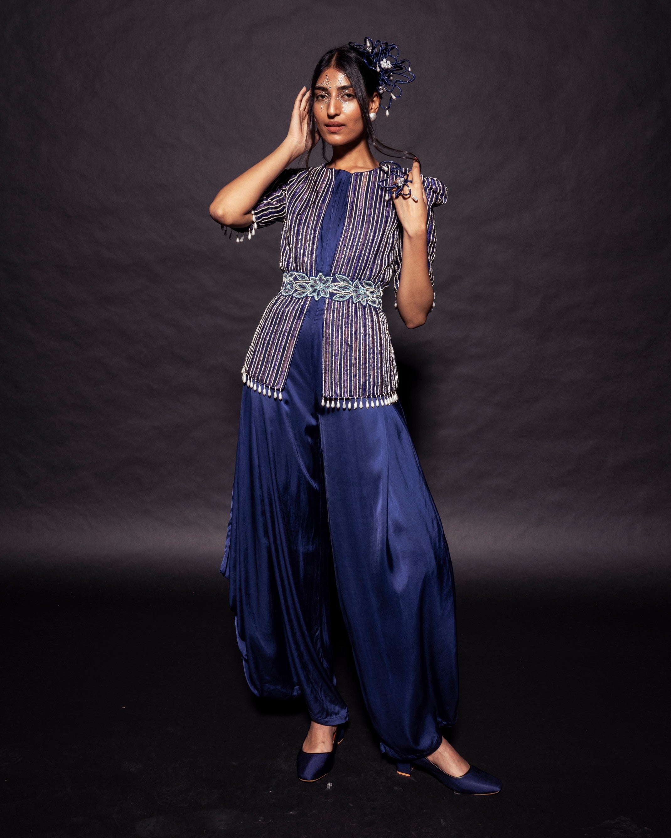 Deep blue side cowl jumpsuit with Ajrakh embellished jacket with patchwork waistbelt