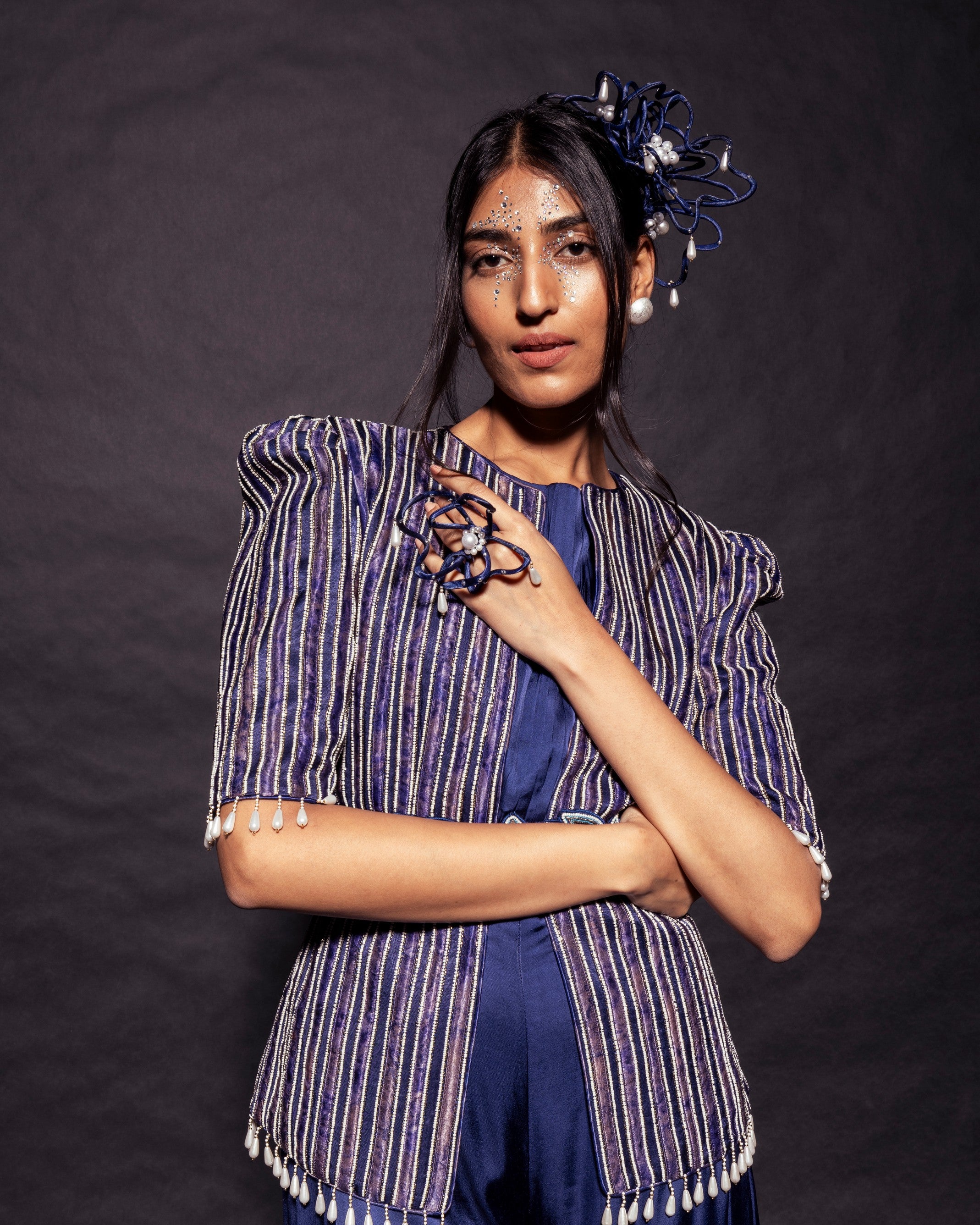 Deep blue side cowl jumpsuit with Ajrakh embellished jacket with patchwork waistbelt