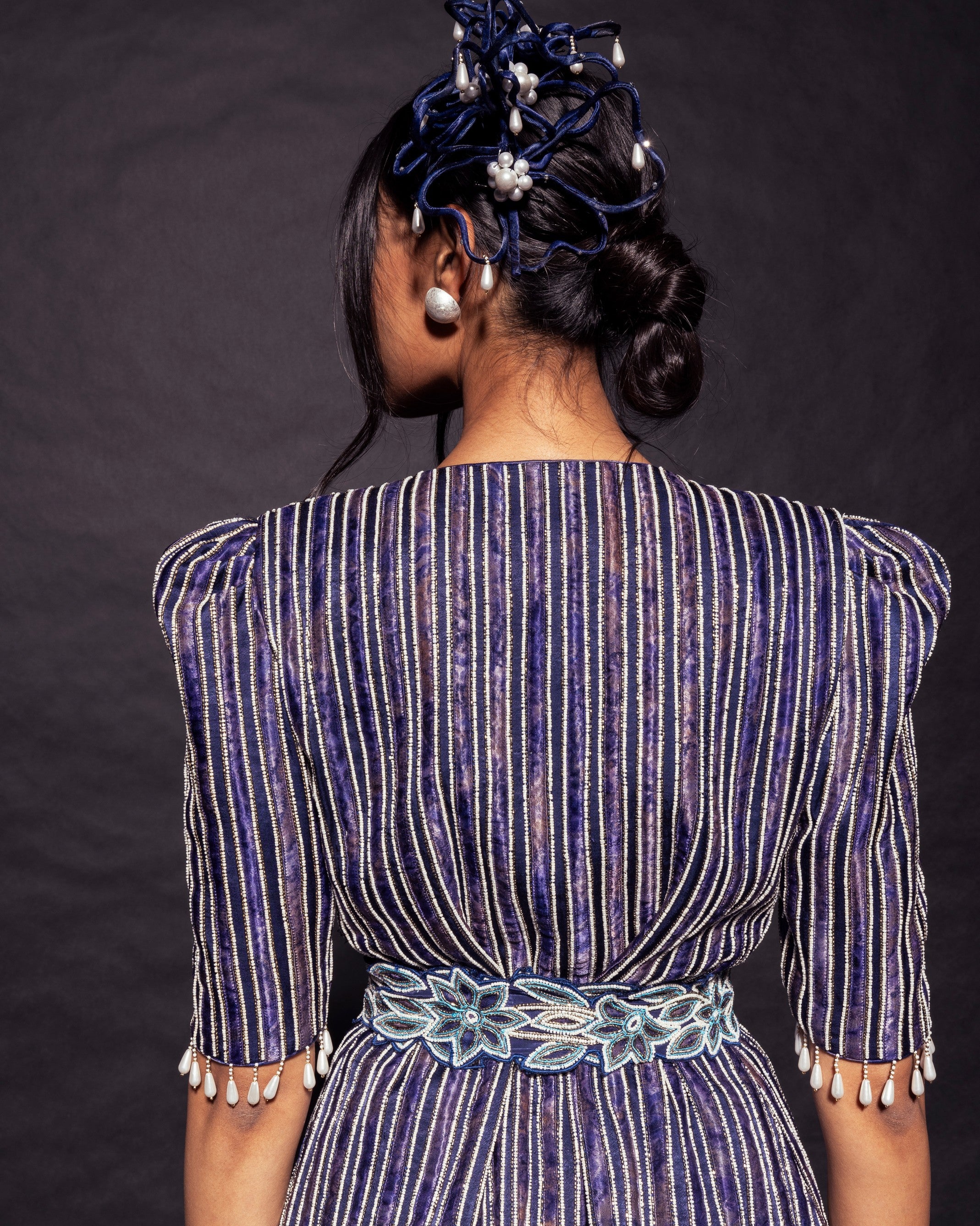 Deep blue side cowl jumpsuit with Ajrakh embellished jacket with patchwork waistbelt