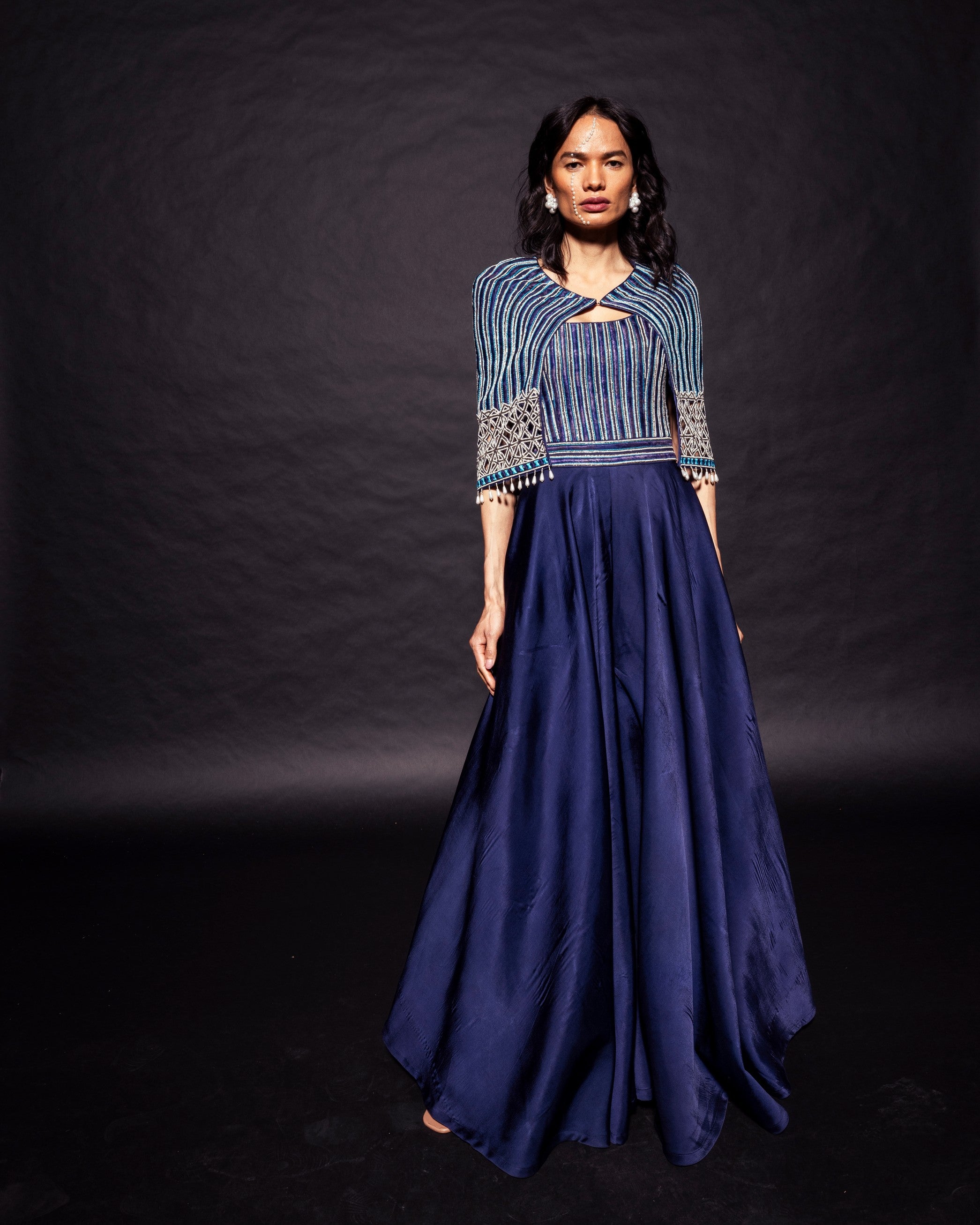 Deep blue ajrakh embellished jumpsuit with fully embsllished ajrakh stripwork cape jacket