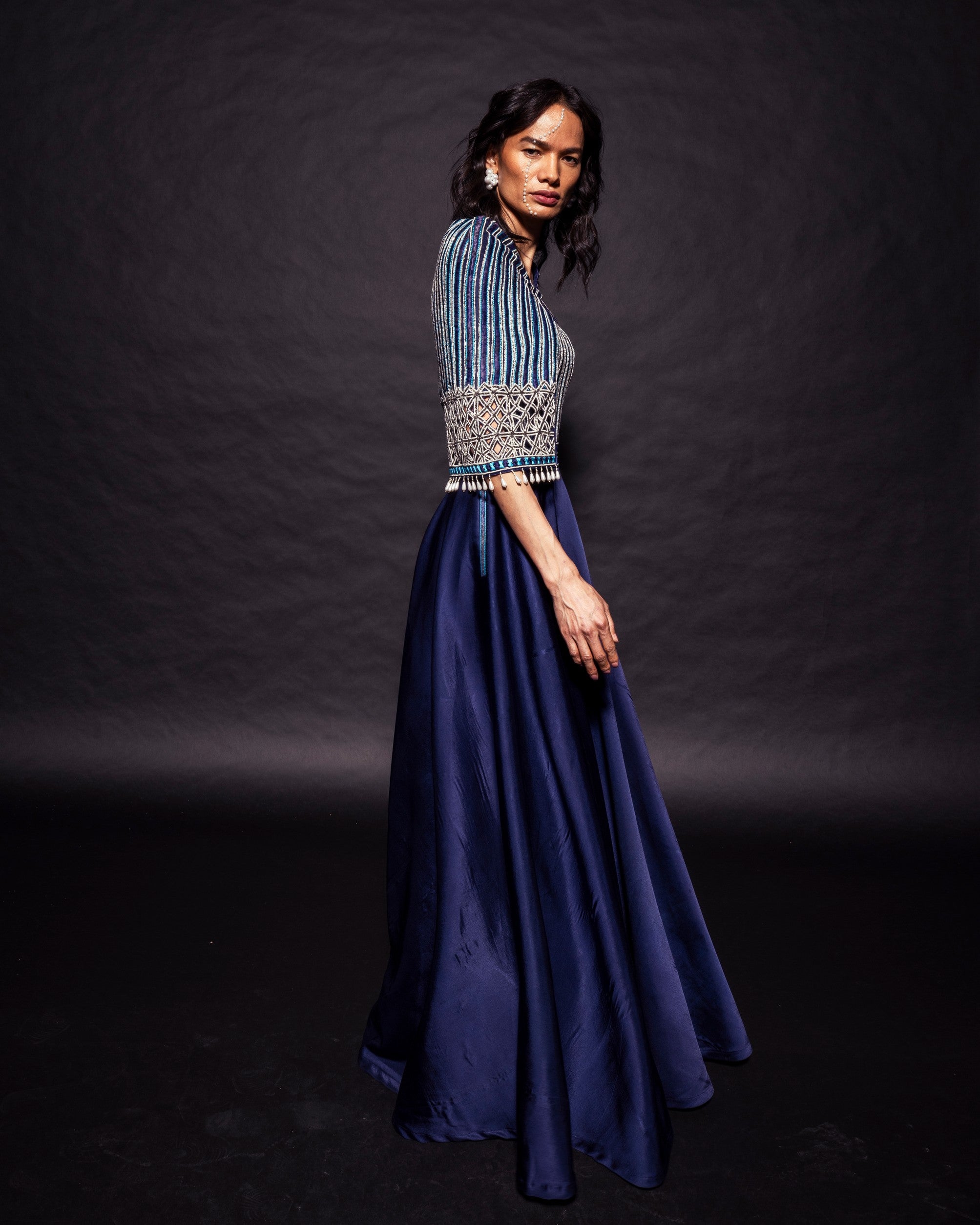 Deep blue ajrakh embellished jumpsuit with fully embsllished ajrakh stripwork cape jacket