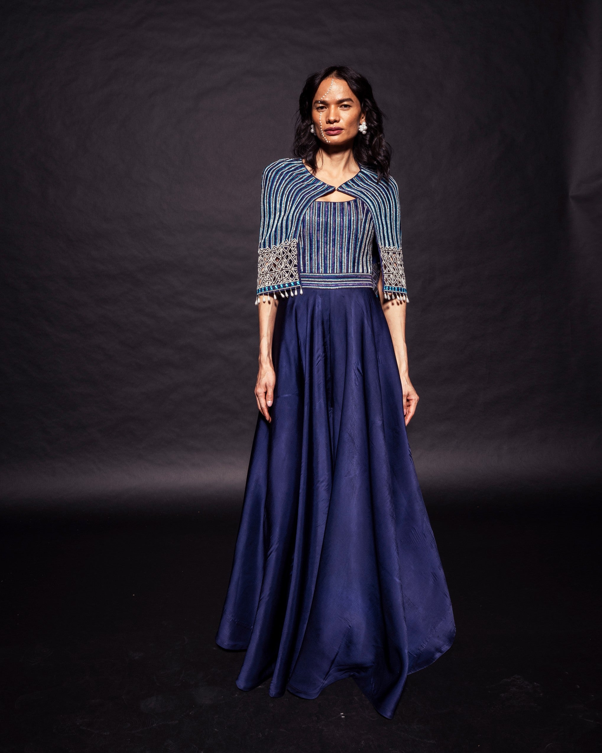 Deep blue ajrakh embellished jumpsuit with fully embsllished ajrakh stripwork cape jacket