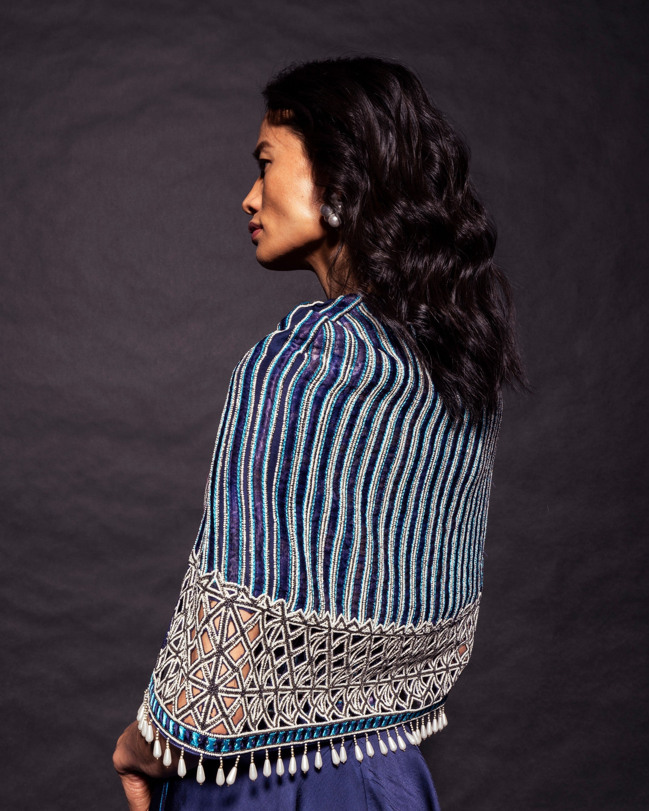 Deep blue ajrakh embellished jumpsuit with fully embsllished ajrakh stripwork cape jacket