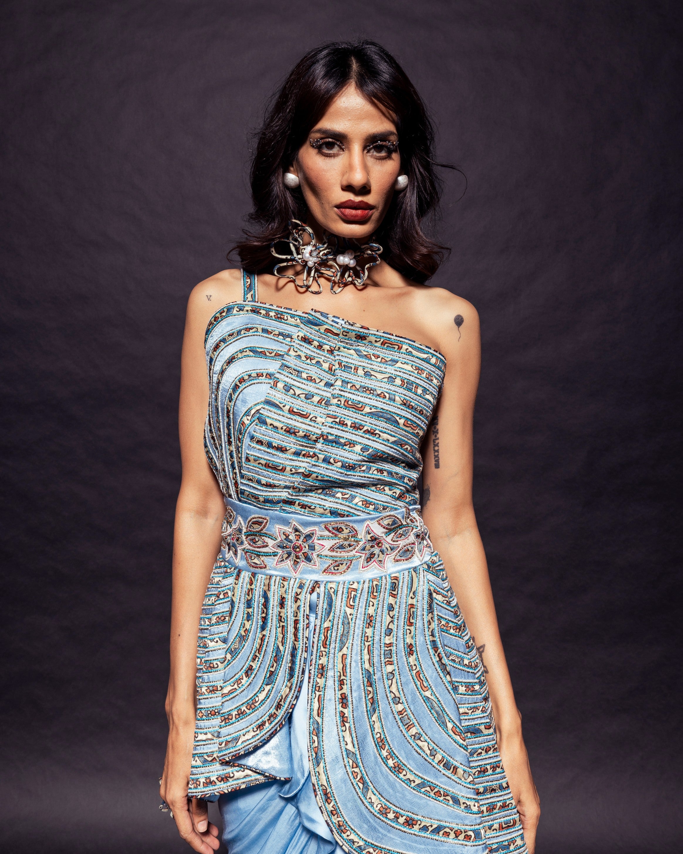 Powder blue ajrakh embroidered assymetric peplum top with Drape dhoti skirt