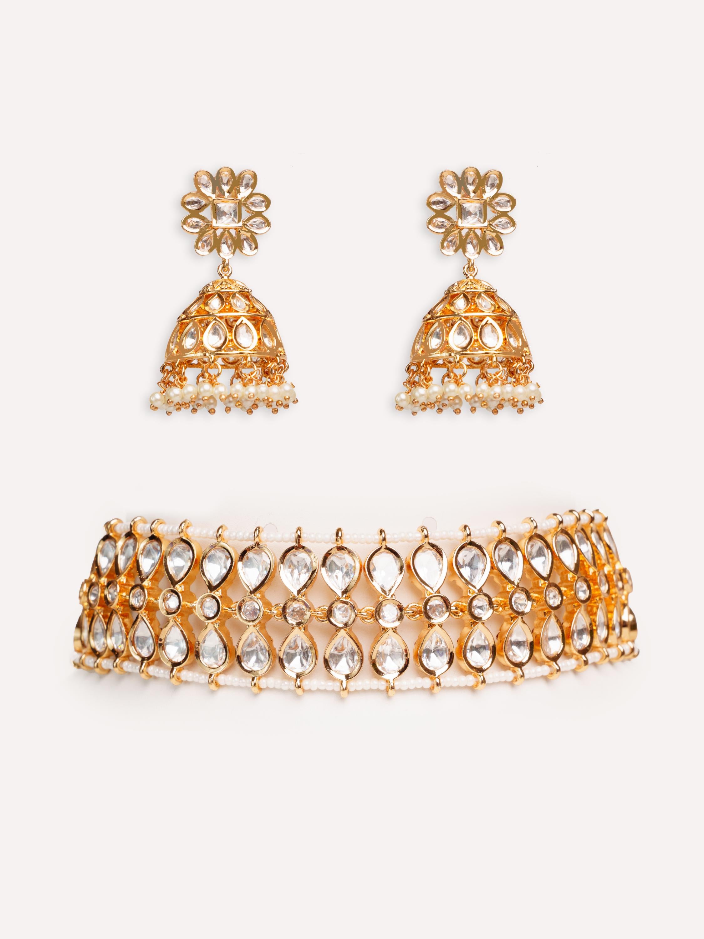 Classy kundan choker set with elegant pair of jhumkis.