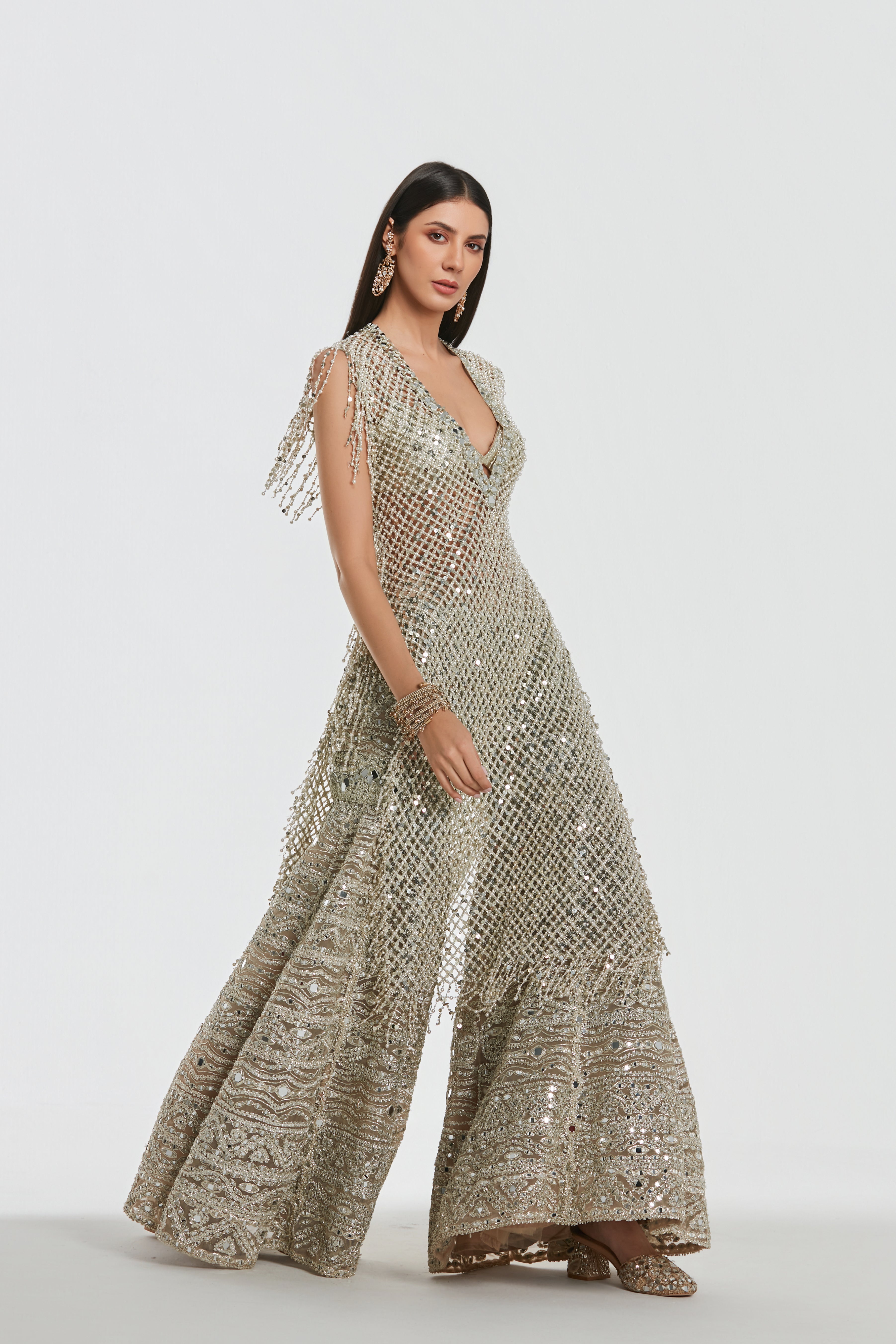 Mirror work , pearl beads, zari , sequins ,gota