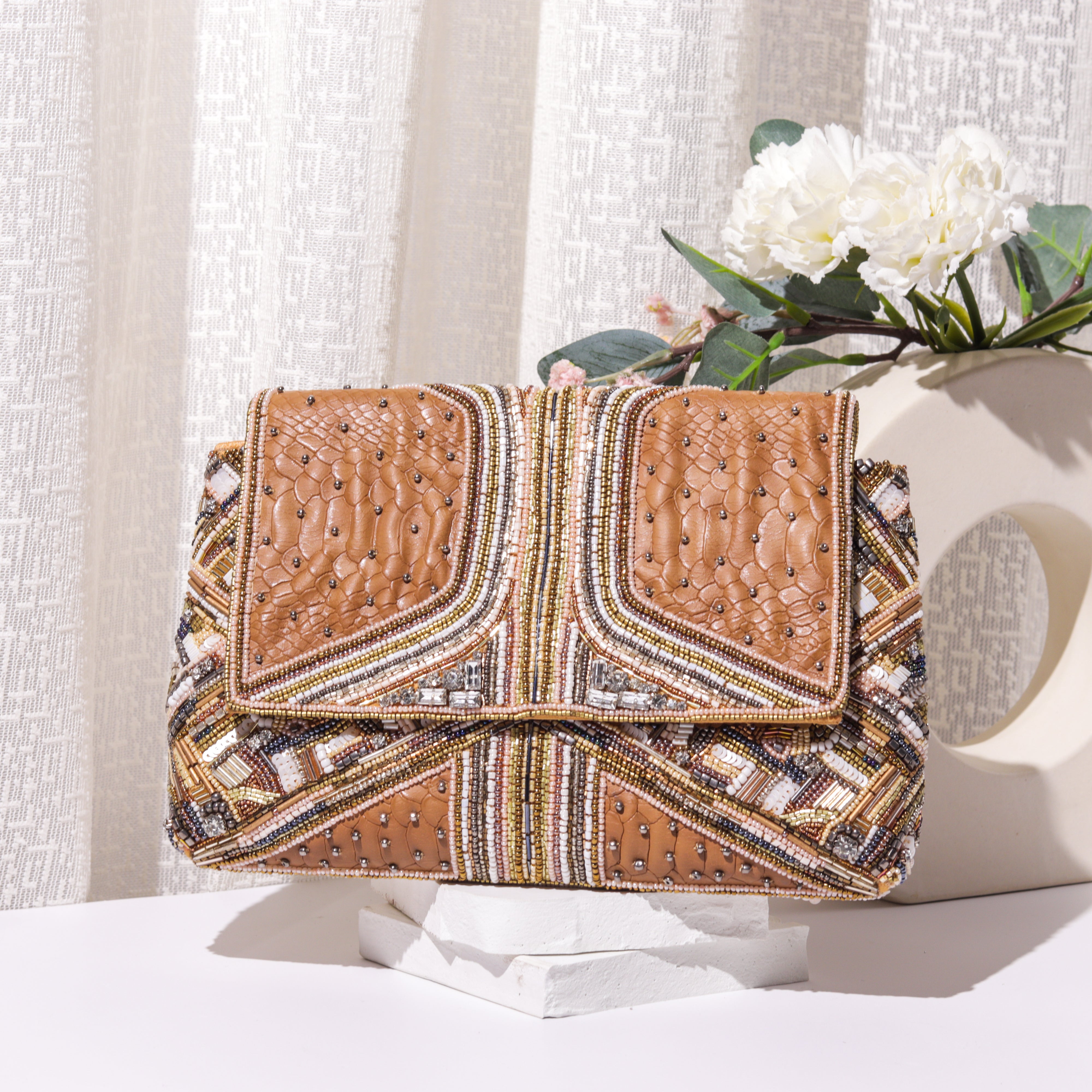 Theiya tan clutch