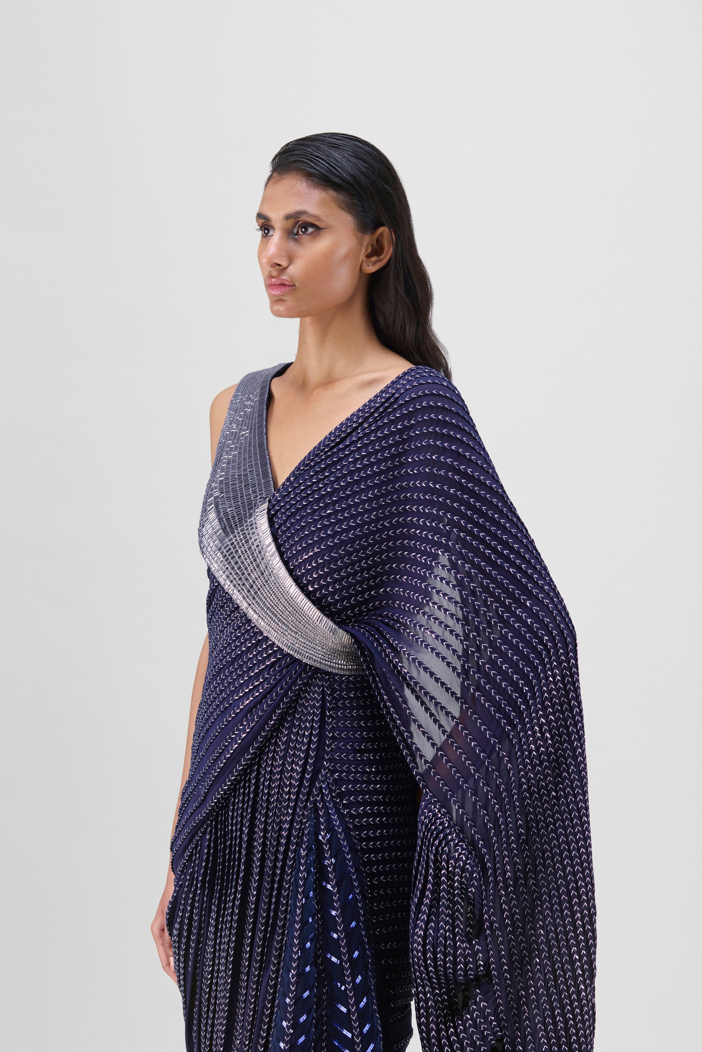 METALLIC STRUCTURED GOWN WITH RUFFLE BRAIDED DRAPE