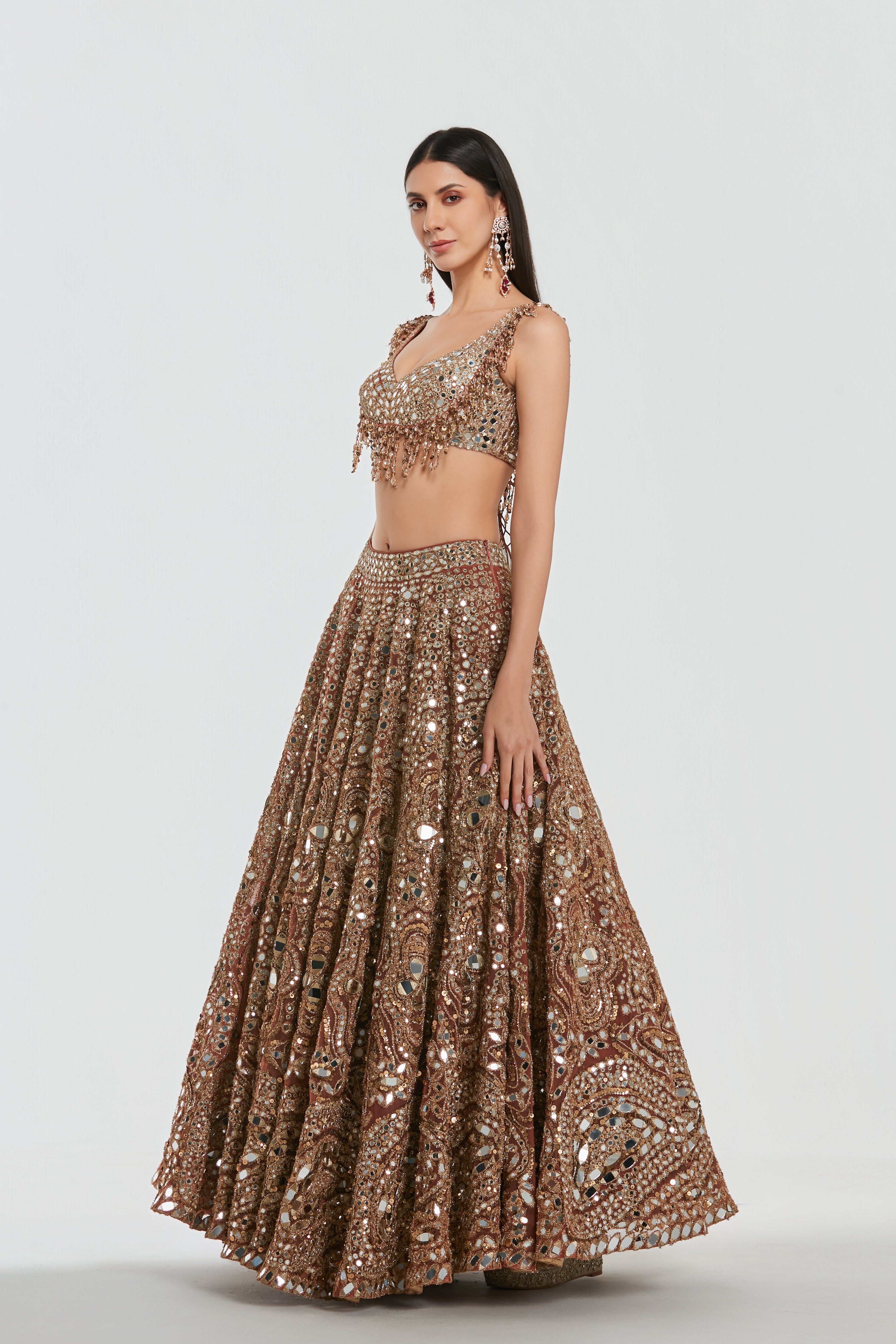 Mirror work , zari , lurex thread, glass beads