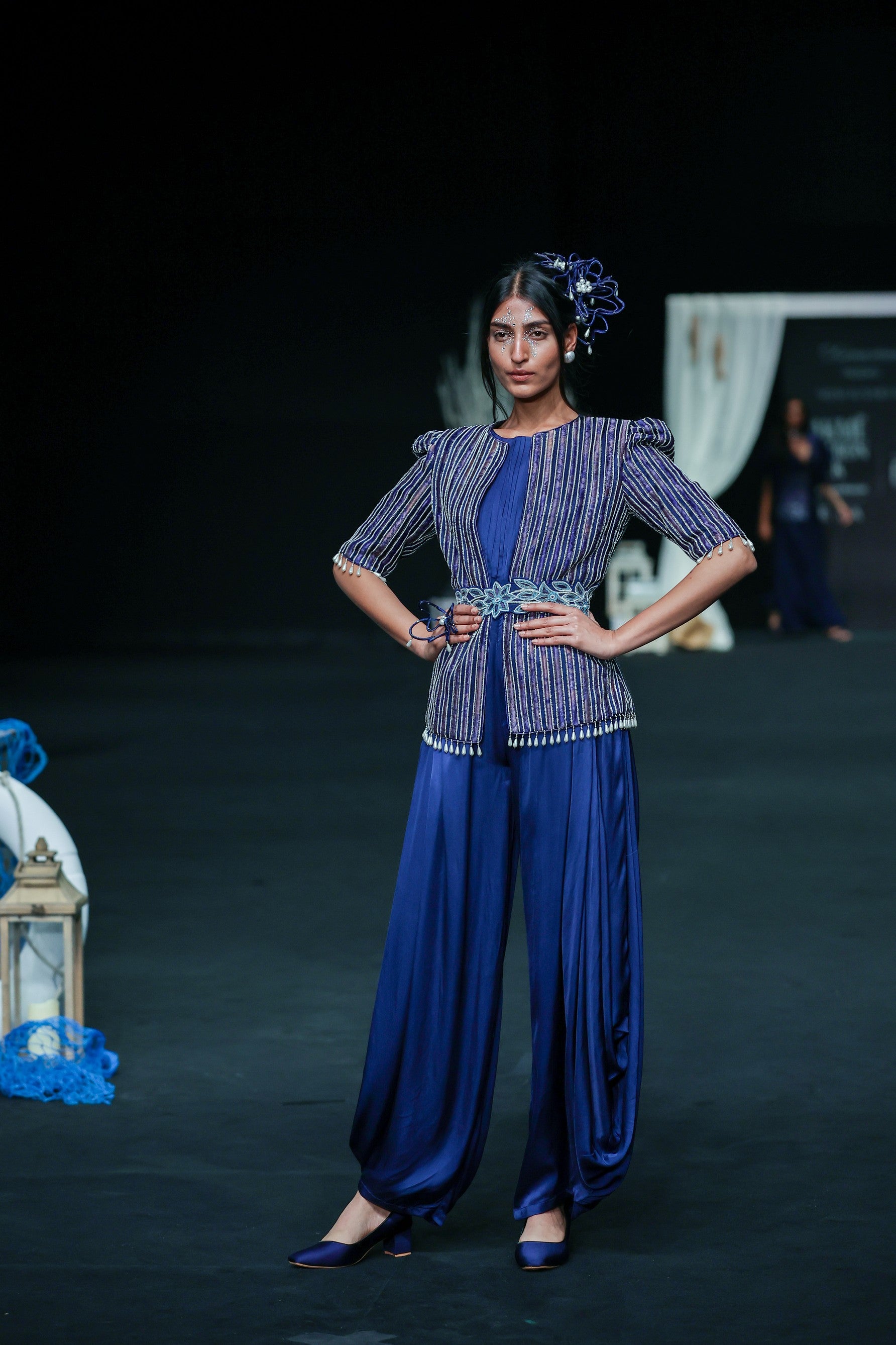 Deep blue side cowl jumpsuit with Ajrakh embellished jacket with patchwork waistbelt