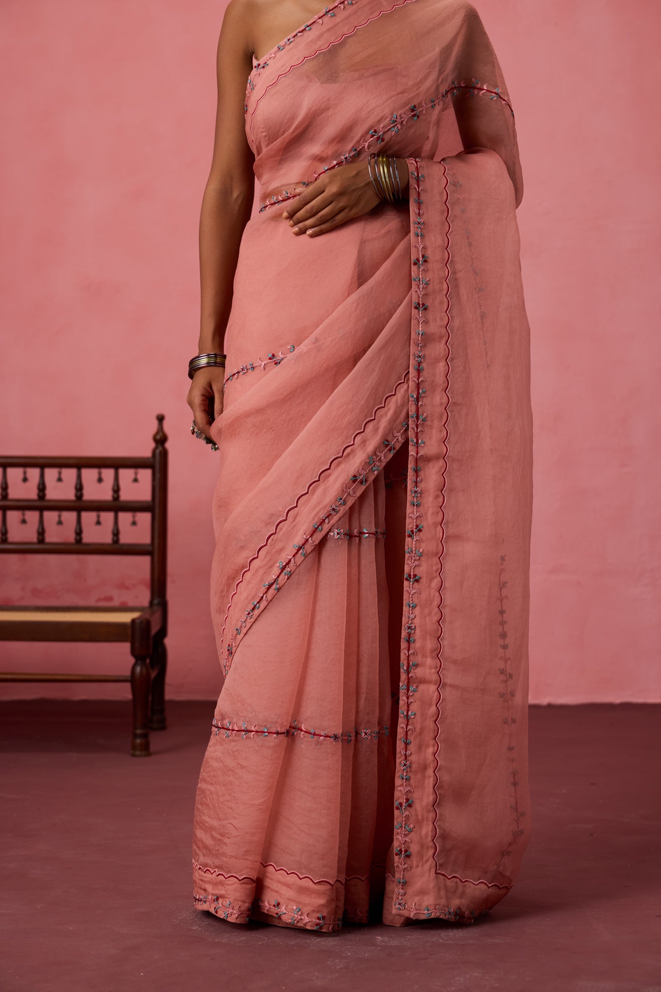 Peach organza embroidered saree comes with unstitched & unembroidered blouse fabric in chanderi