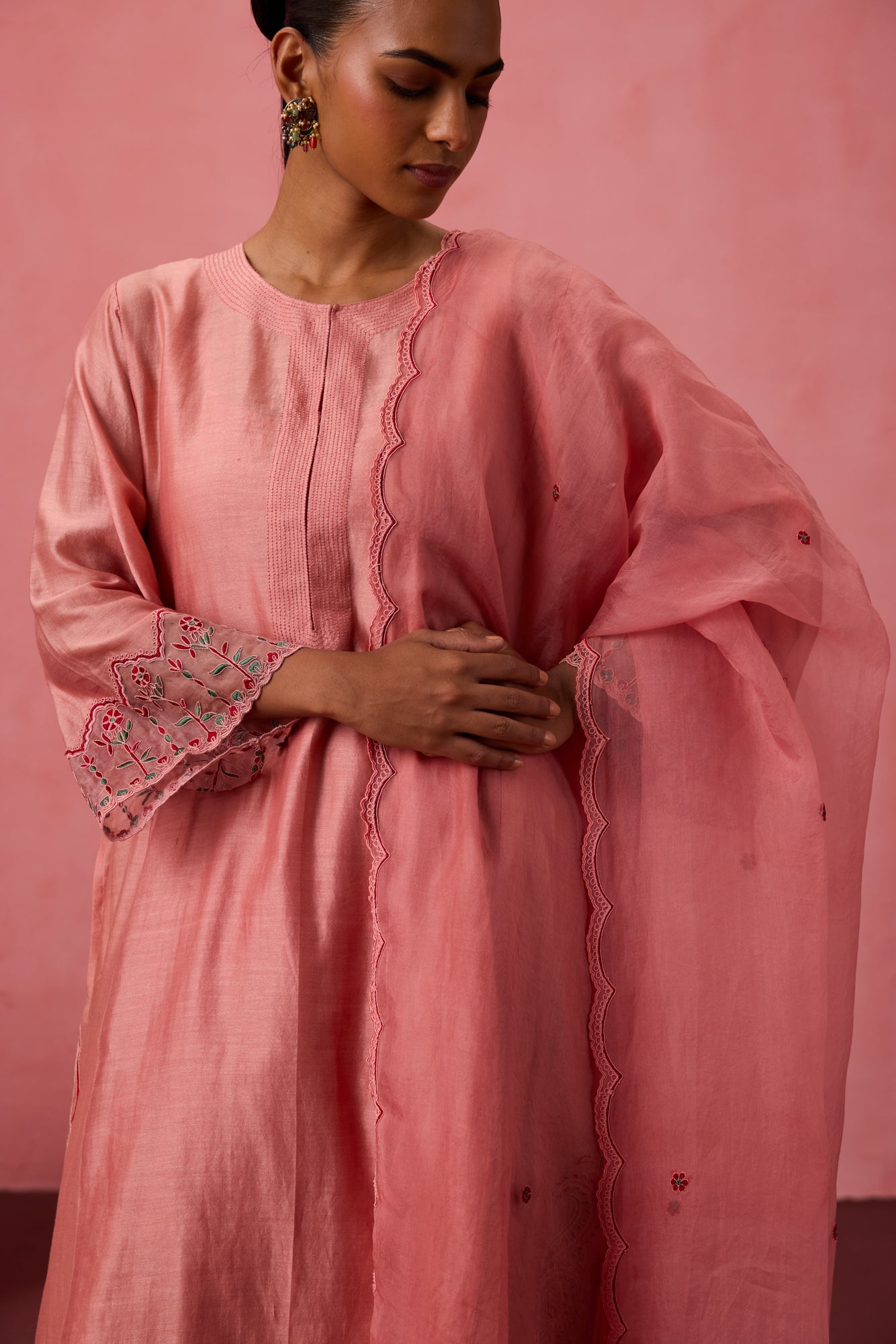 Peach chanderi embroidered kurta with embellished border on sleeves paired with an organic cotton slip pant & organza dupatta