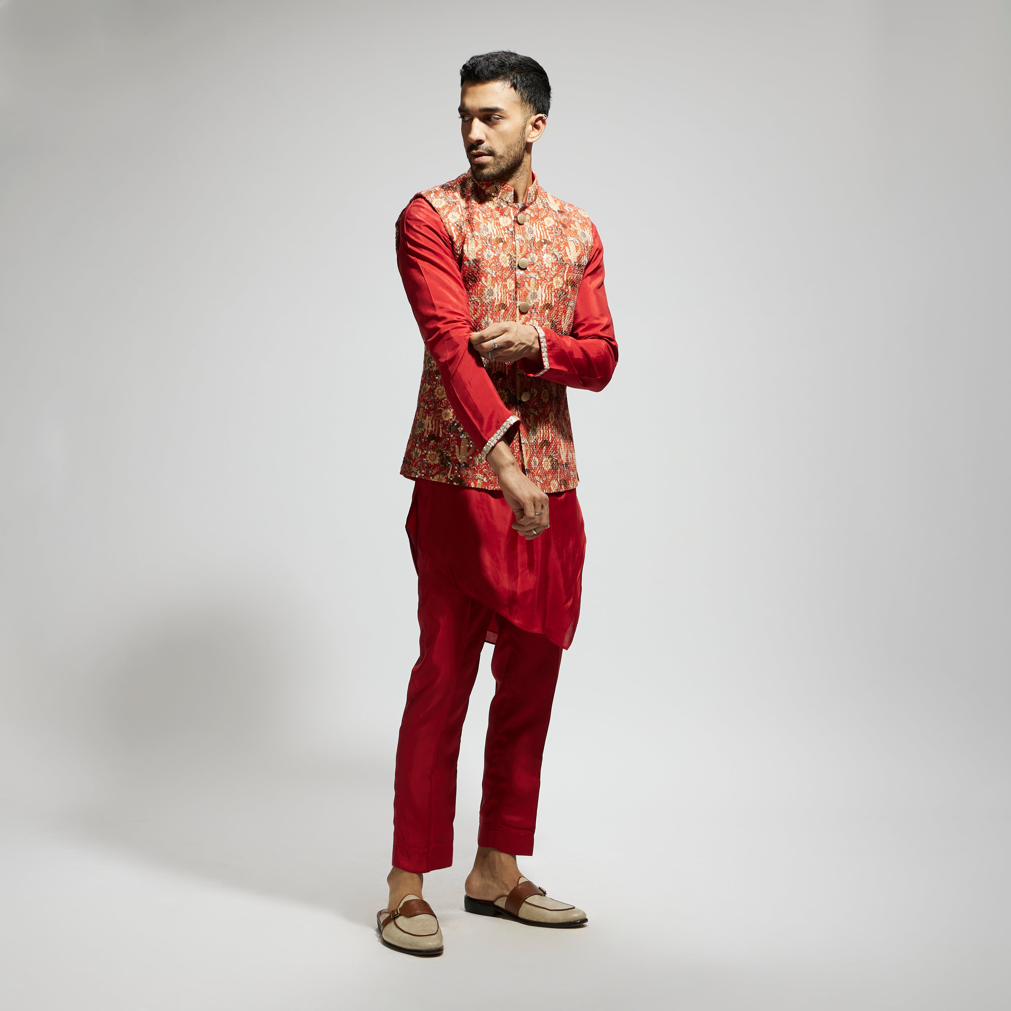 ORANGE JAAL EMBELLISHED BUNDI PAIRED WITH ORANGE DRAPE KURTA AND PANTS