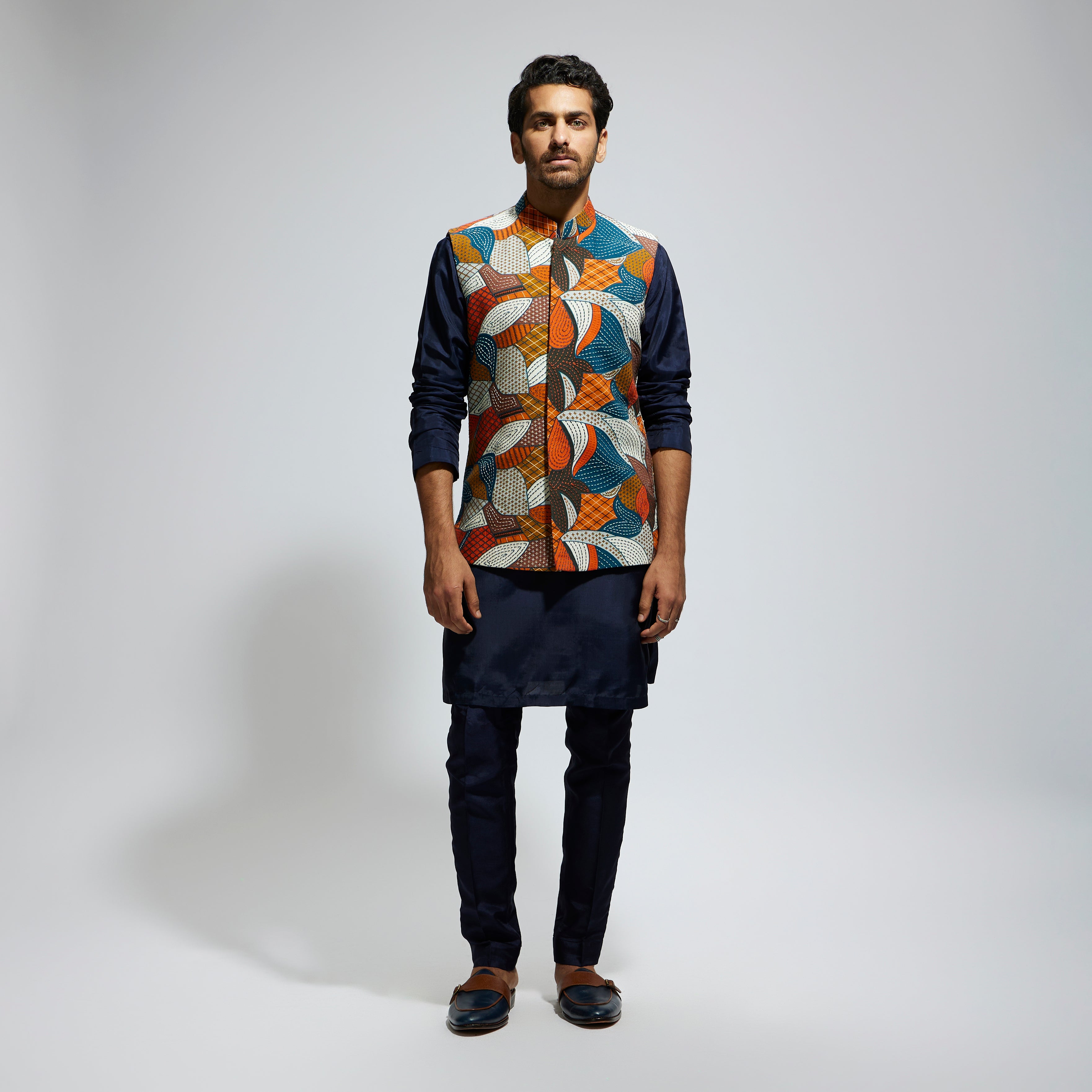 ABSTRACT BUNDI PAIRED WITH SOLID BLUE KURTA AND PANTS