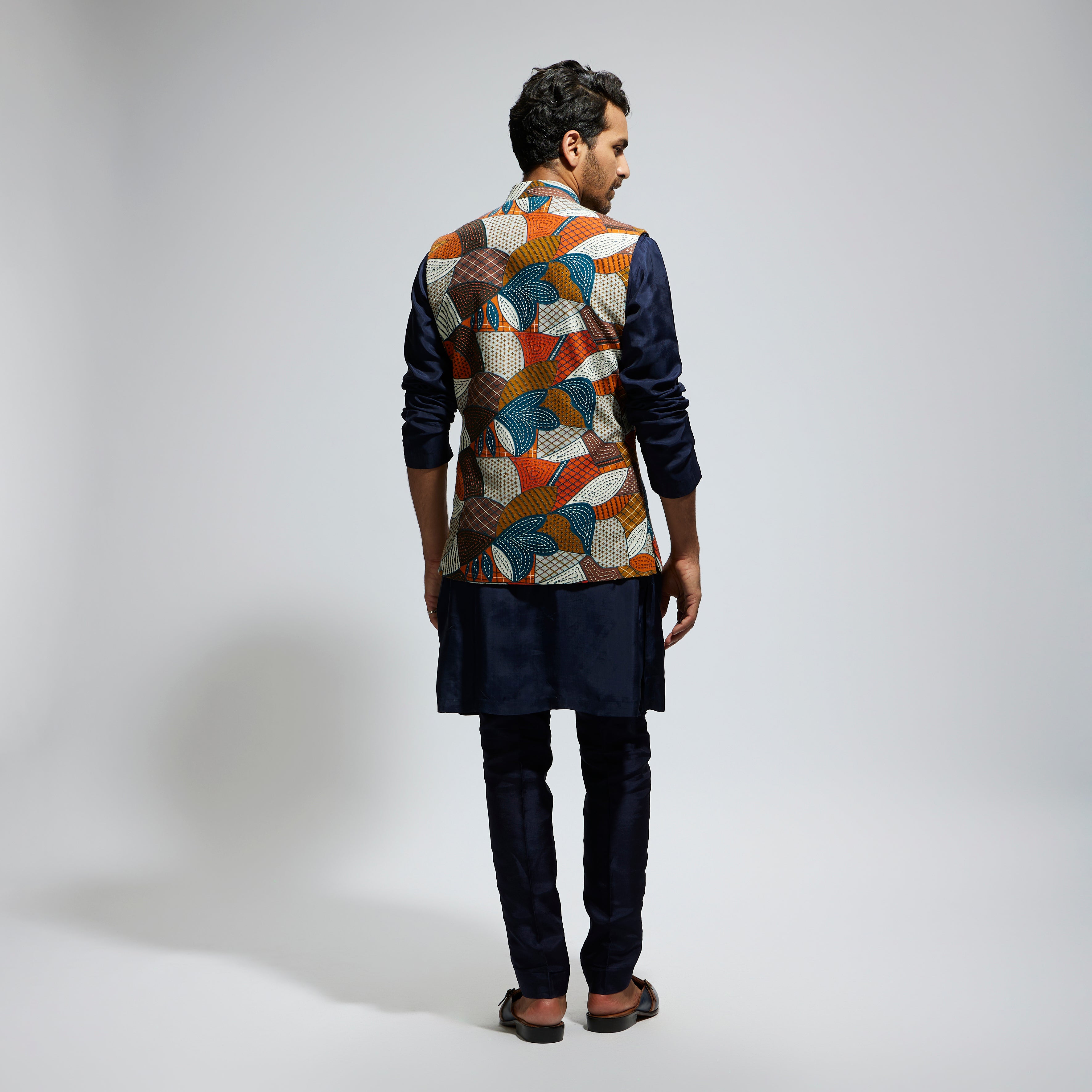 ABSTRACT BUNDI PAIRED WITH SOLID BLUE KURTA AND PANTS