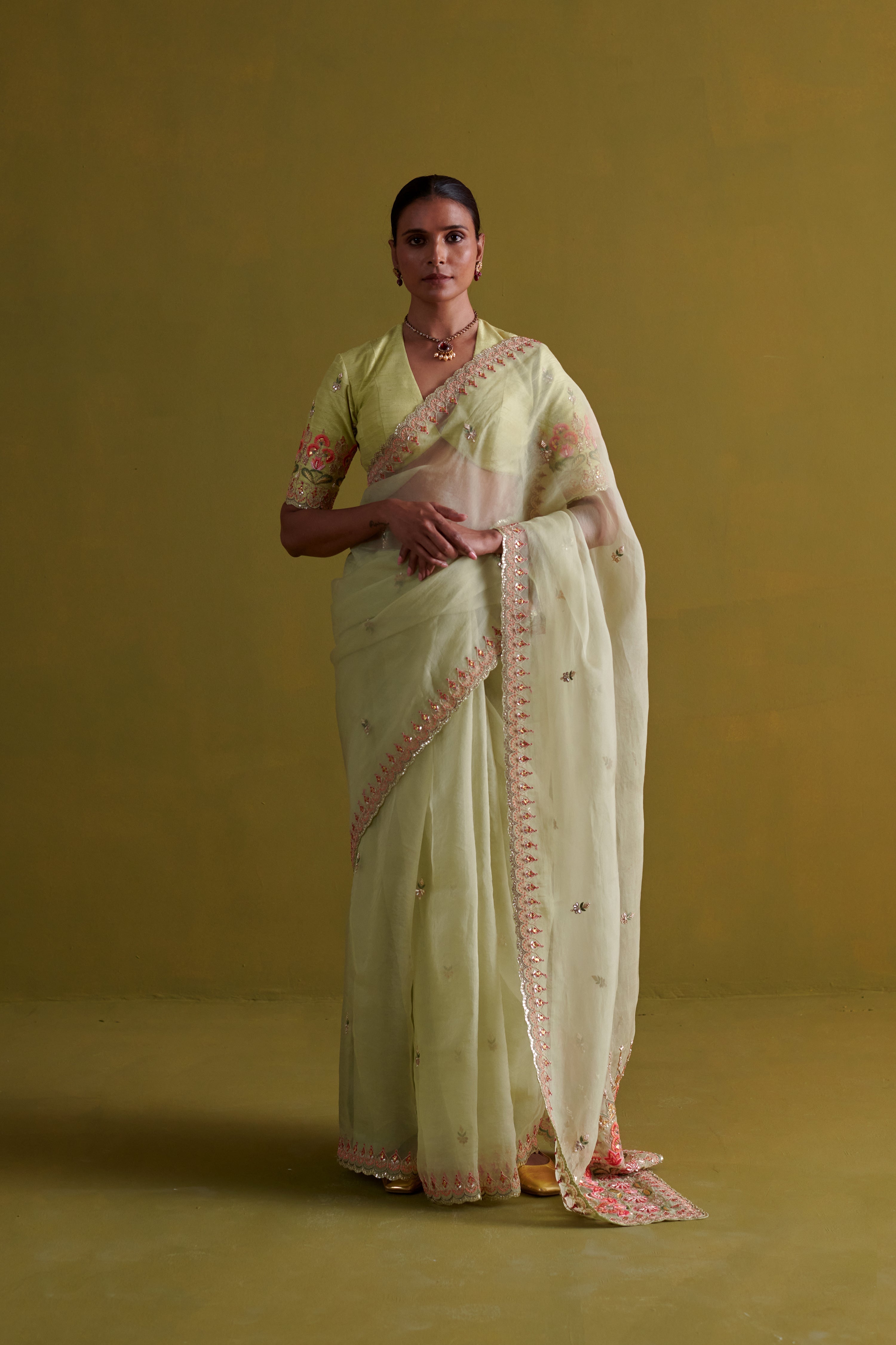 Sage green hand embrodiered saree with raw silk blouse
