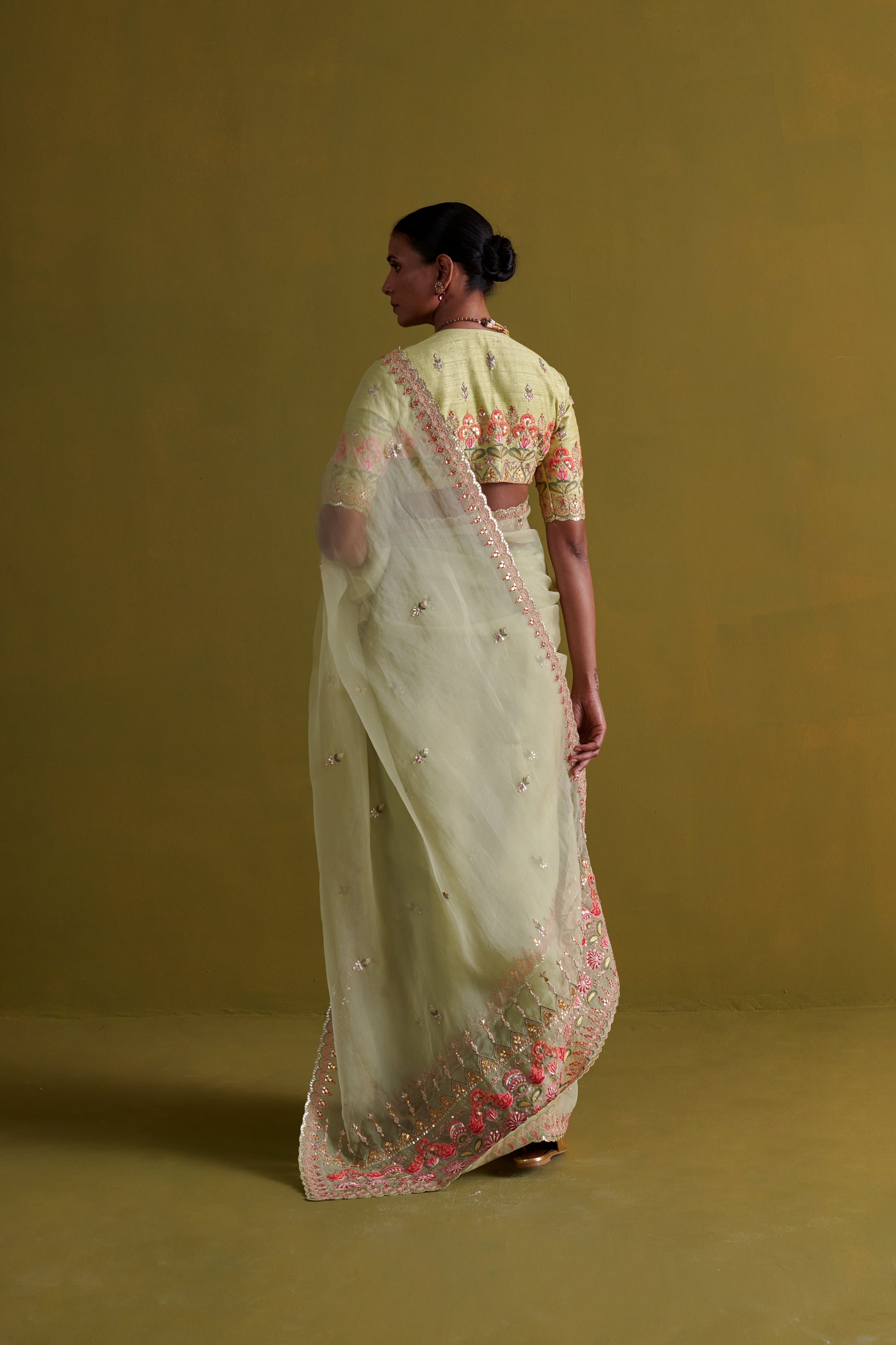 Sage green hand embrodiered saree with raw silk blouse