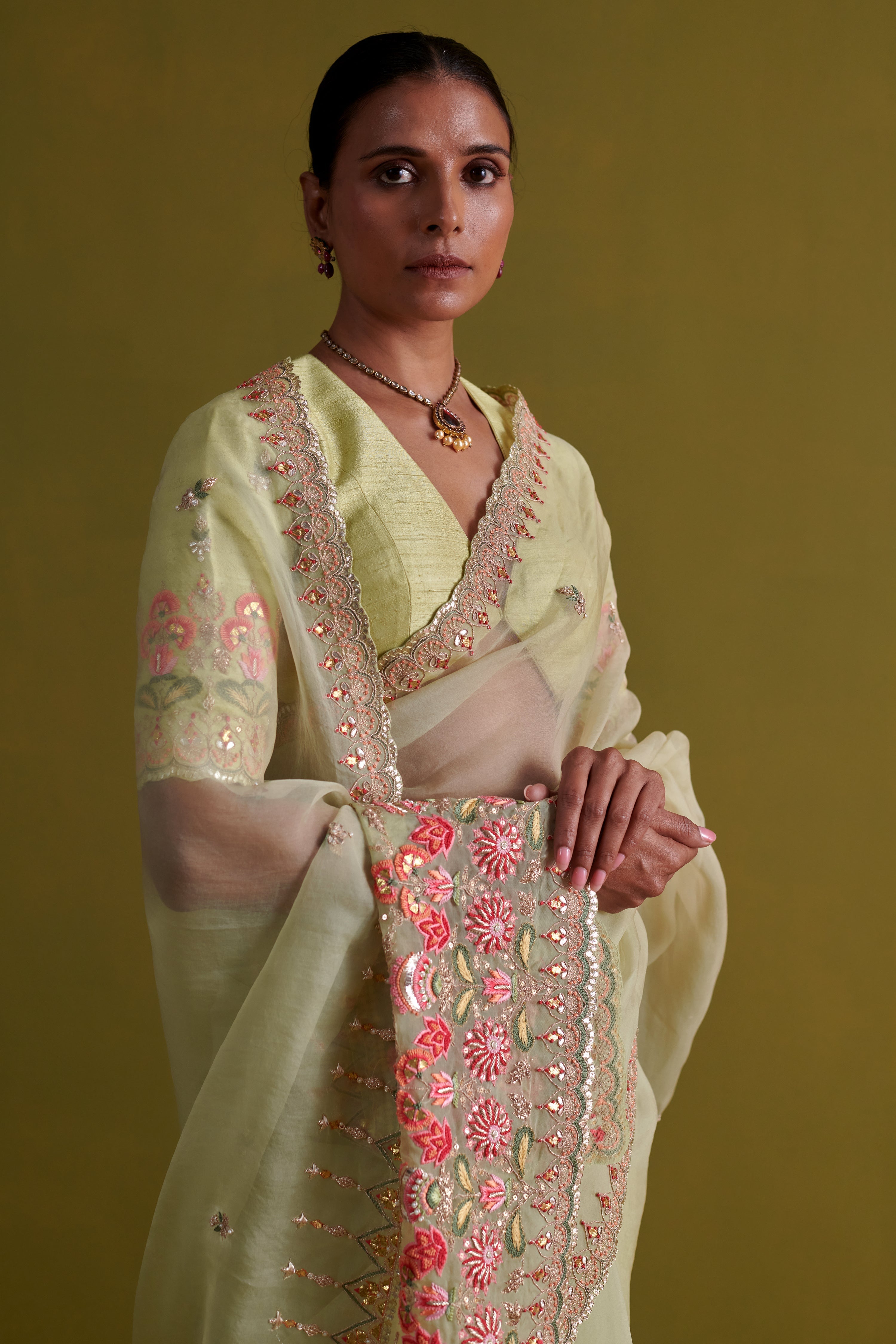 Sage green hand embrodiered saree with raw silk blouse