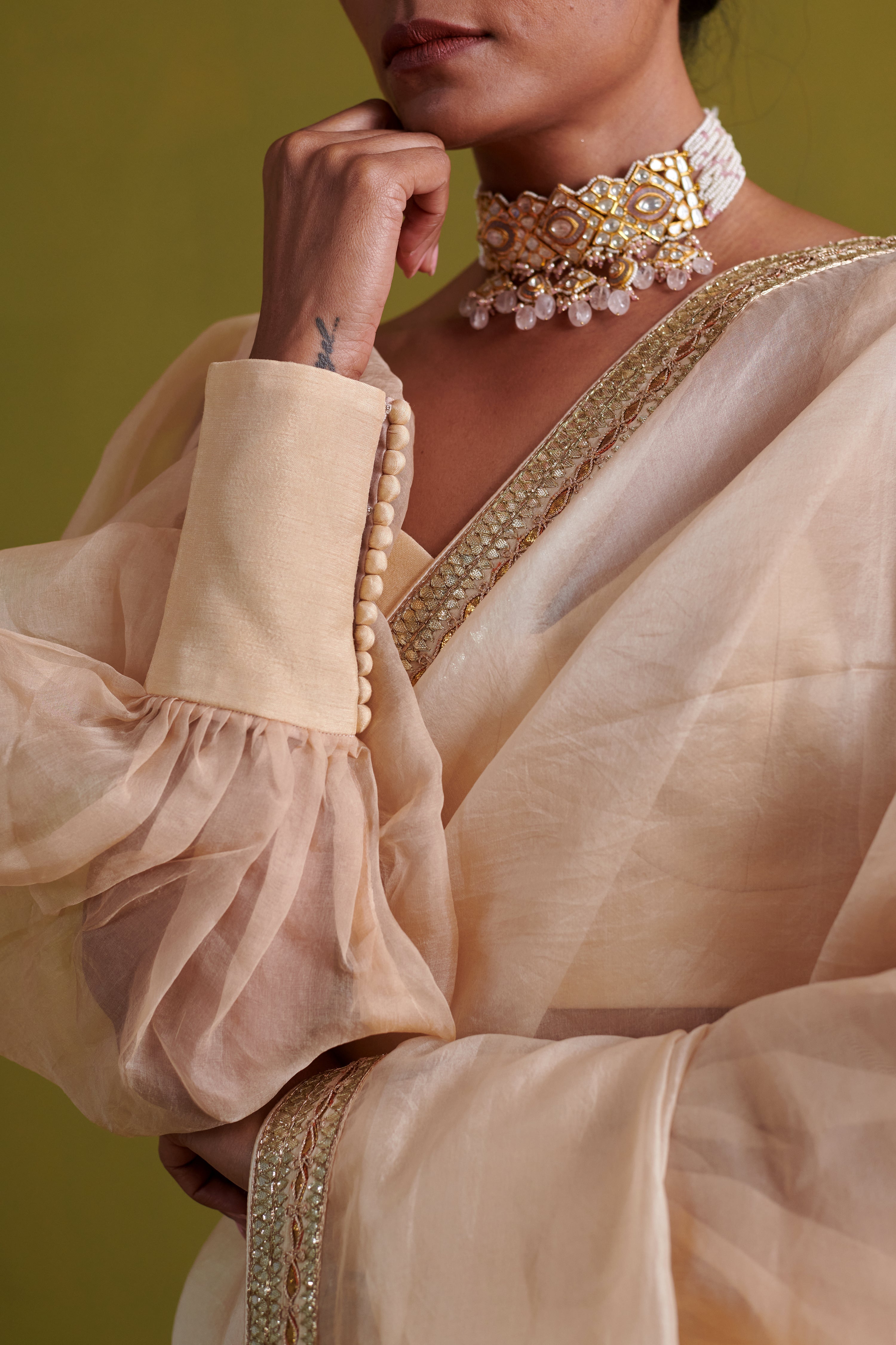 Beige hand embrodiered saree with raw silk blouse