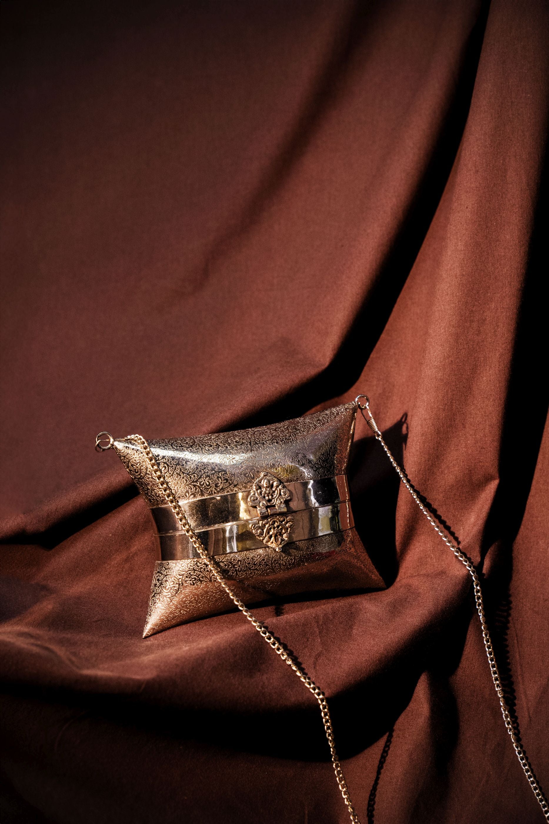 ETHNIC BRASS BAG WITH INTRICATE PATTERN IN SILVER FINISH