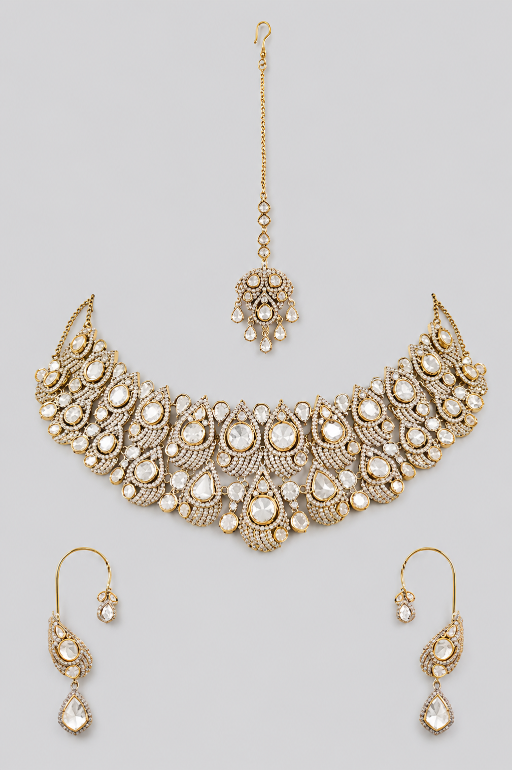 Bold and dramatic polki necklace set with matching earrings and maangtika
