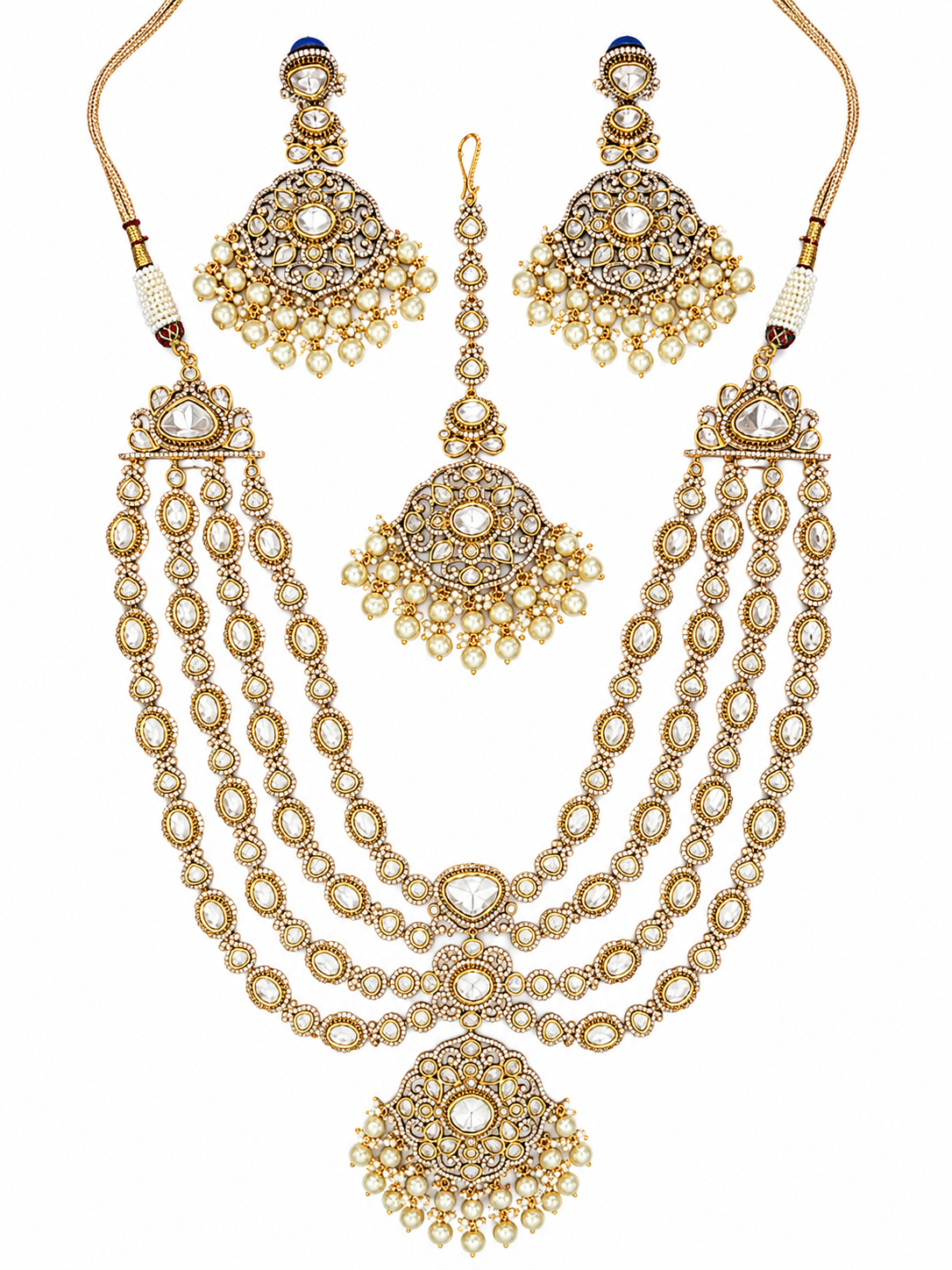 Bold and dramatic polki bridal necklace set with matching earrings and maangtika