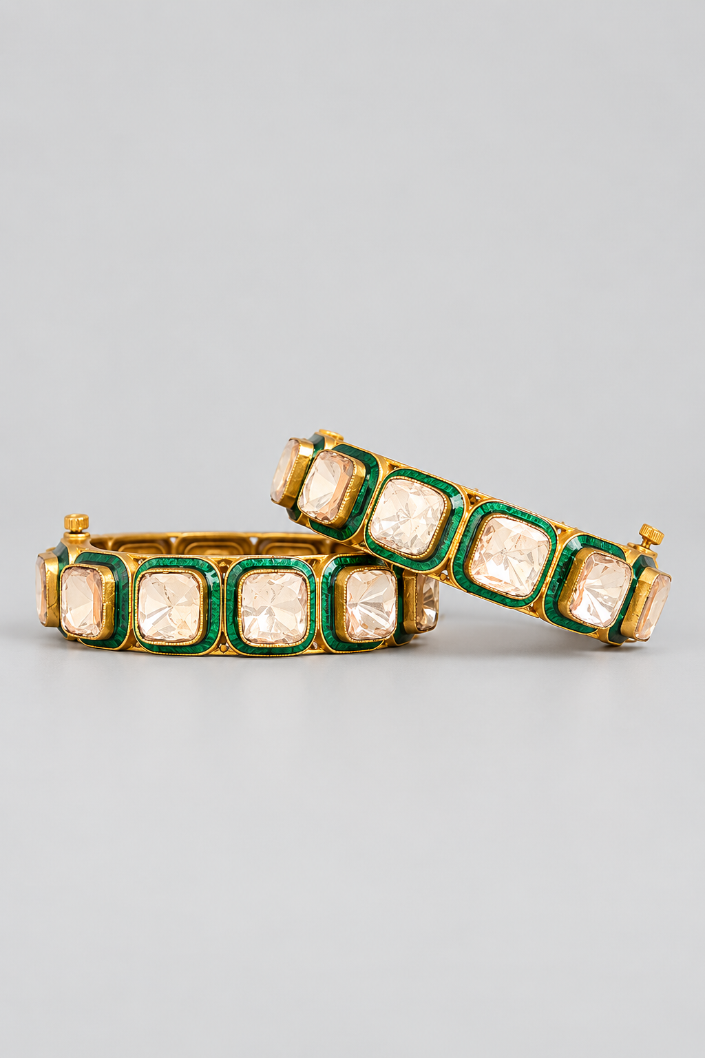 Bold and dramatic pair of kundan polki kadas with green meenakari