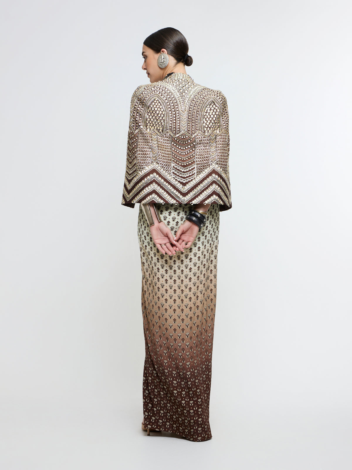 NAZNEEN CAPE JACKET PAIRED WITH METALLIC BUSTIER & SLIT SKIRT