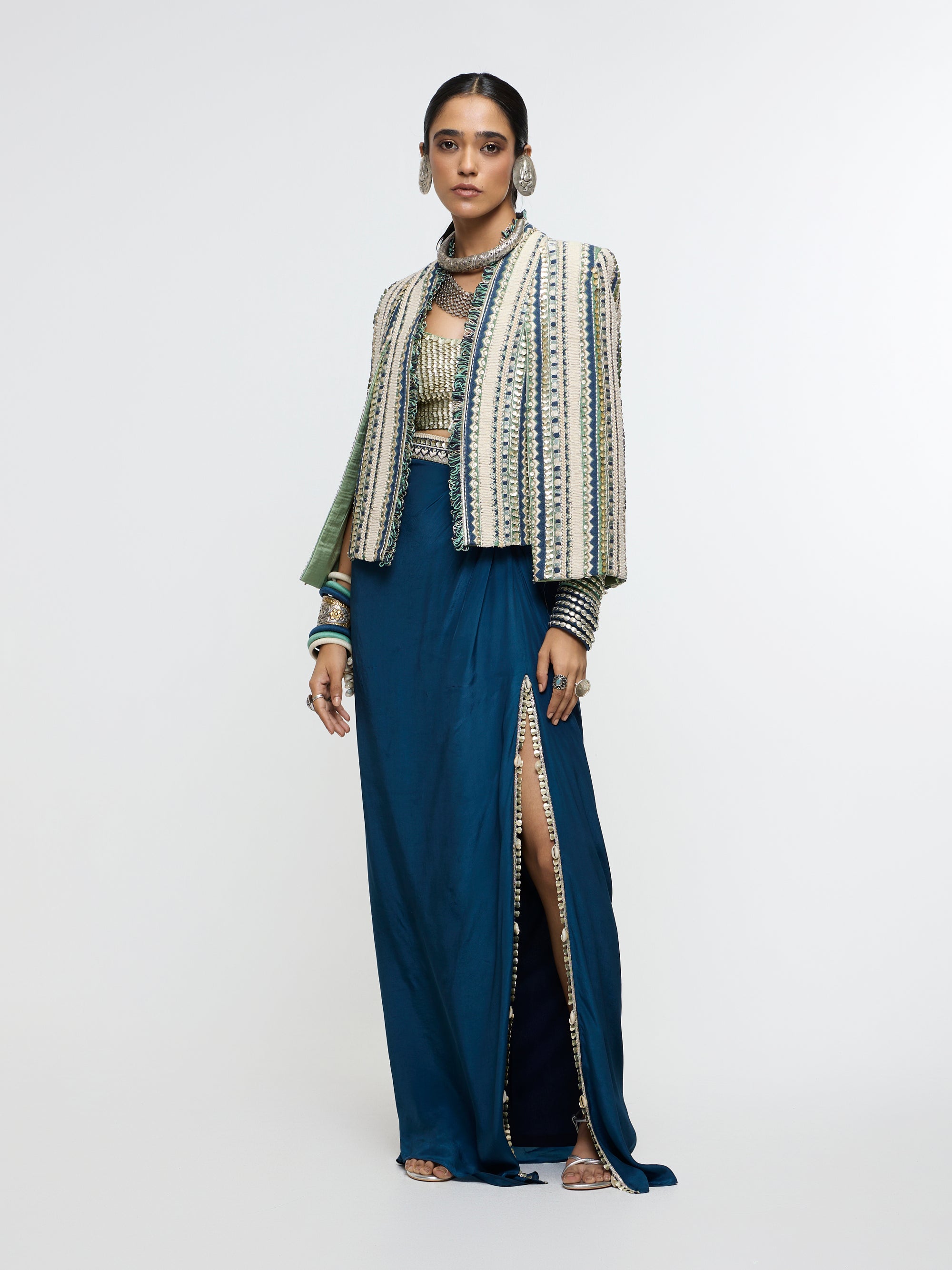 INAAYA EMBLLISHED & TEXTURED JACKET PAIRED WITH METALLIC BUSTIER AND SLIT SKIRT