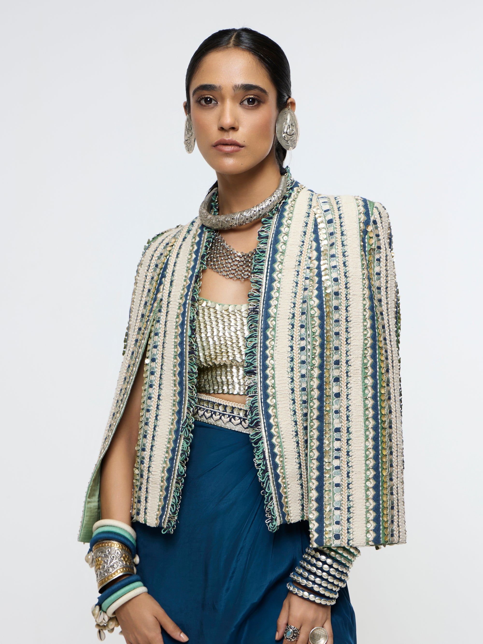 INAAYA EMBLLISHED & TEXTURED JACKET PAIRED WITH METALLIC BUSTIER AND SLIT SKIRT