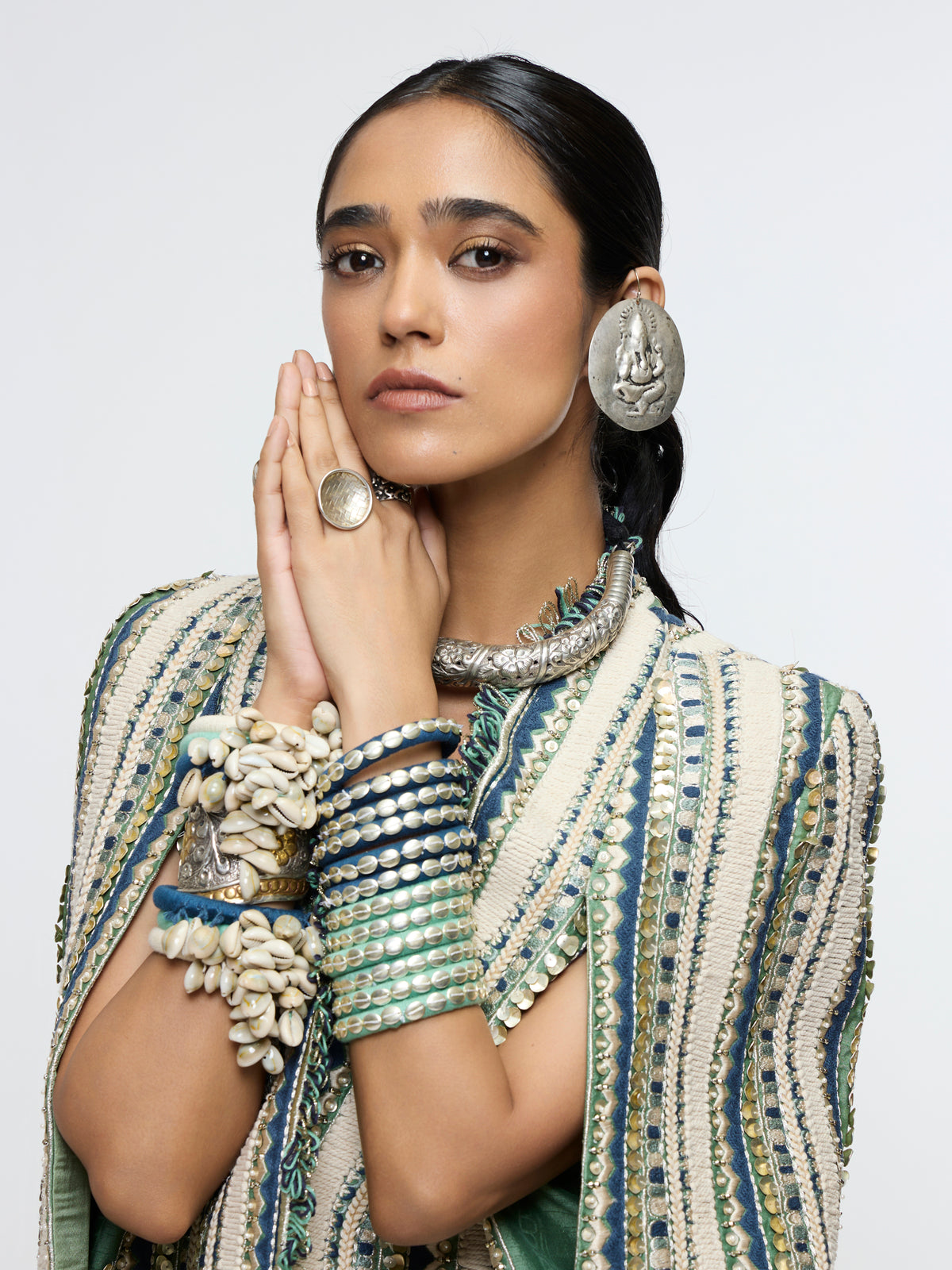 INAAYA EMBLLISHED & TEXTURED JACKET PAIRED WITH METALLIC BUSTIER AND SLIT SKIRT