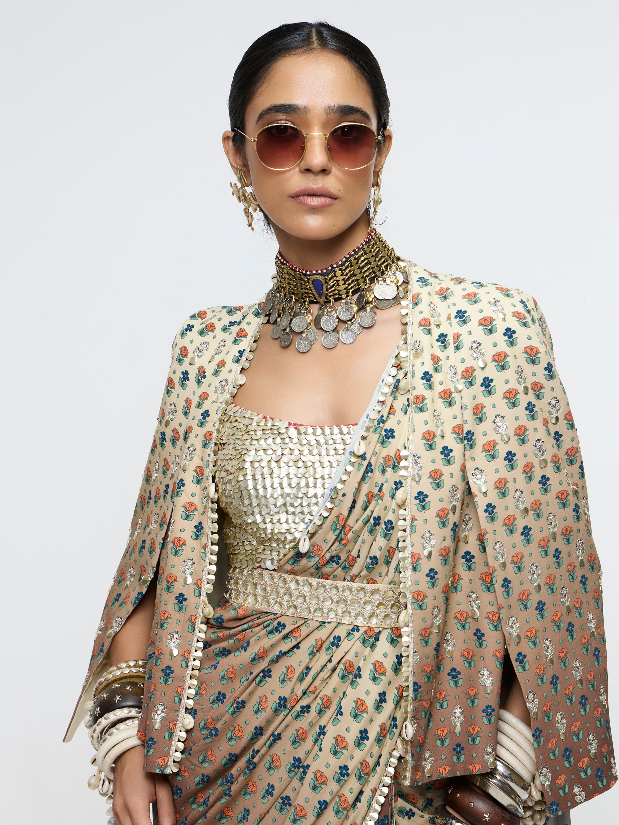 MAHNOOR CAPE JACKET PAIRED WITH METALLIC BUSTIER & DRAPE SAREE