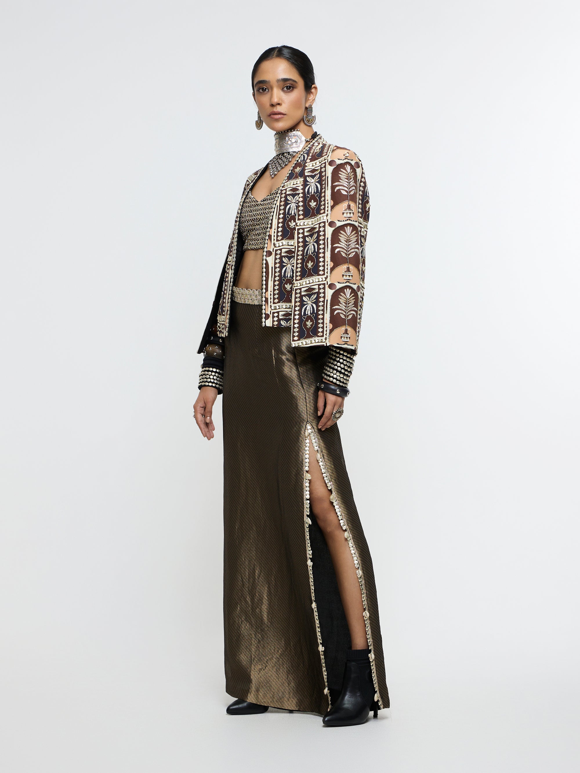 AMER JACKET PAIRED WITH EMBELLISHED BUSTIER AND HIGH-SLIT SKIRT