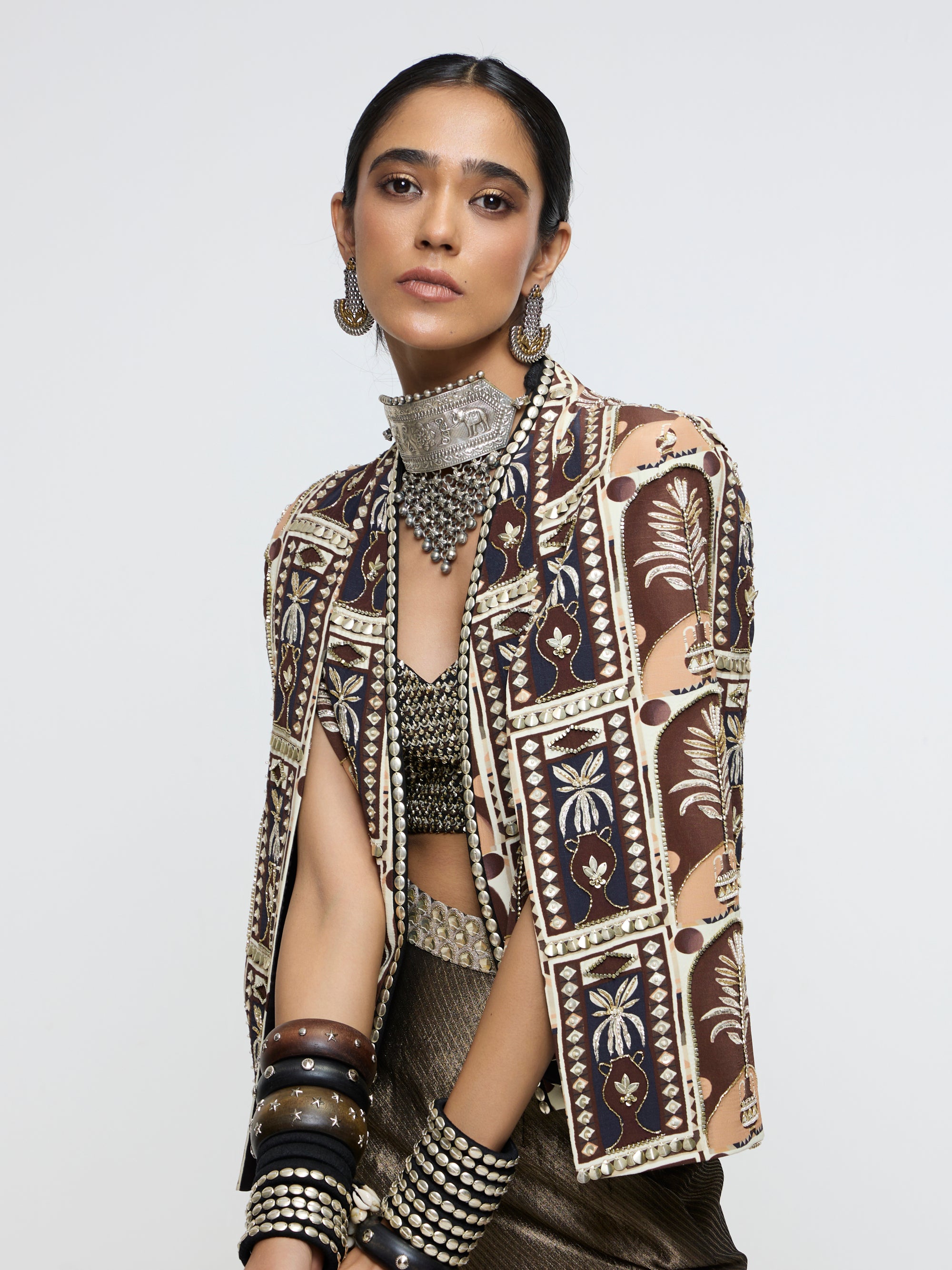 AMER JACKET PAIRED WITH EMBELLISHED BUSTIER AND HIGH-SLIT SKIRT