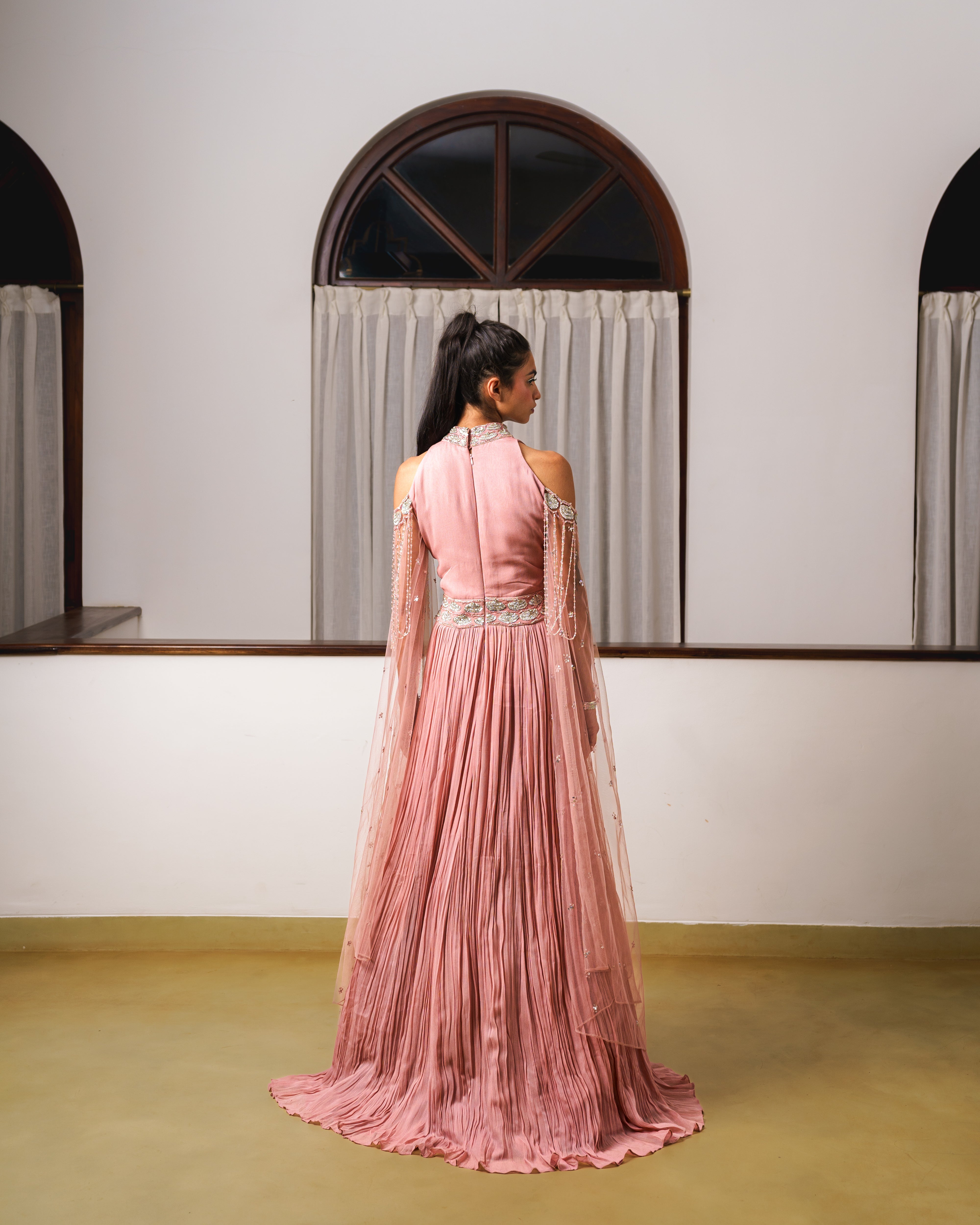 Cold shoulder pleated gown with long sleeves