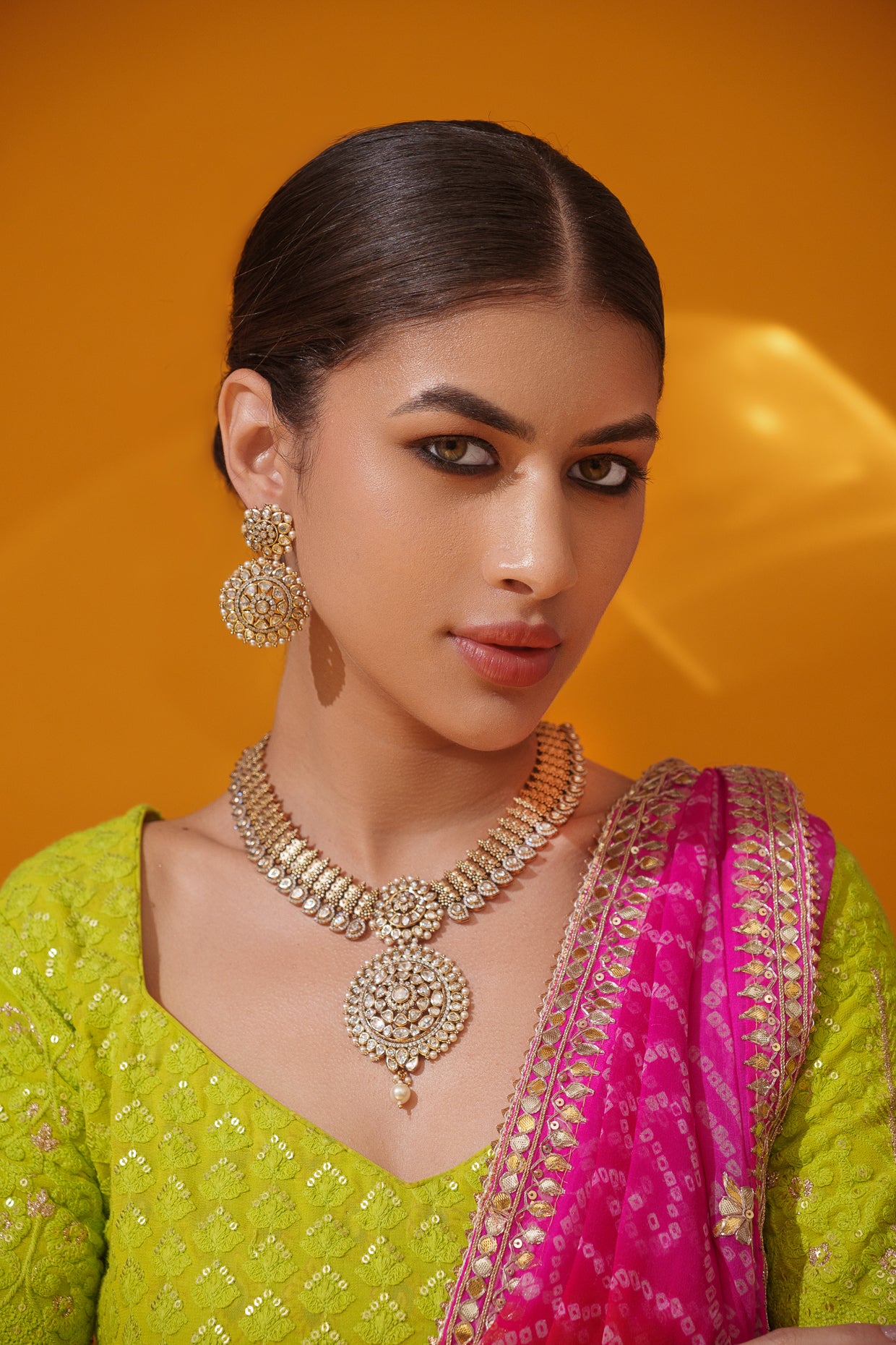 Bold and dramatic kundan pendant necklace with earrings