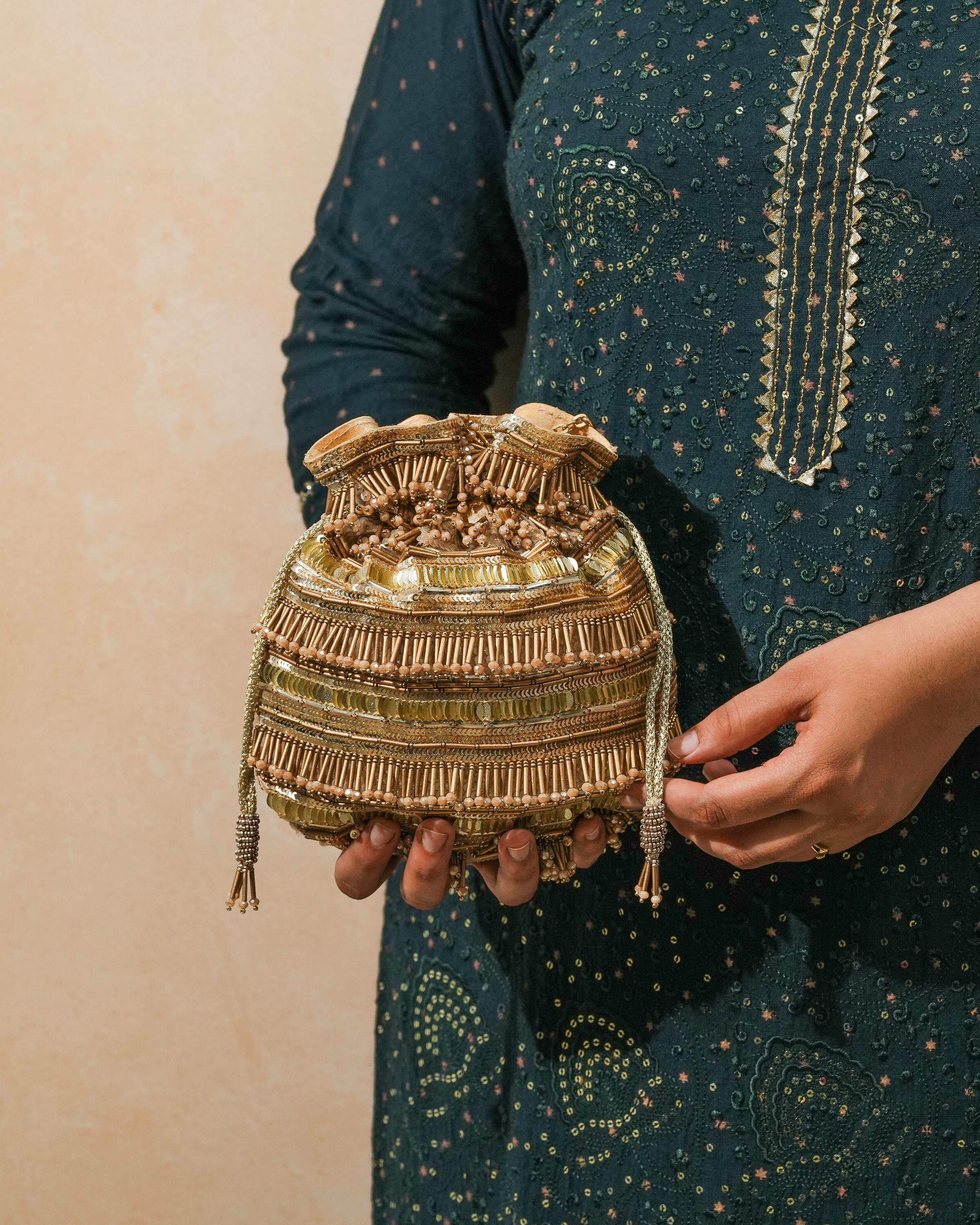 Golden polma tassel potli