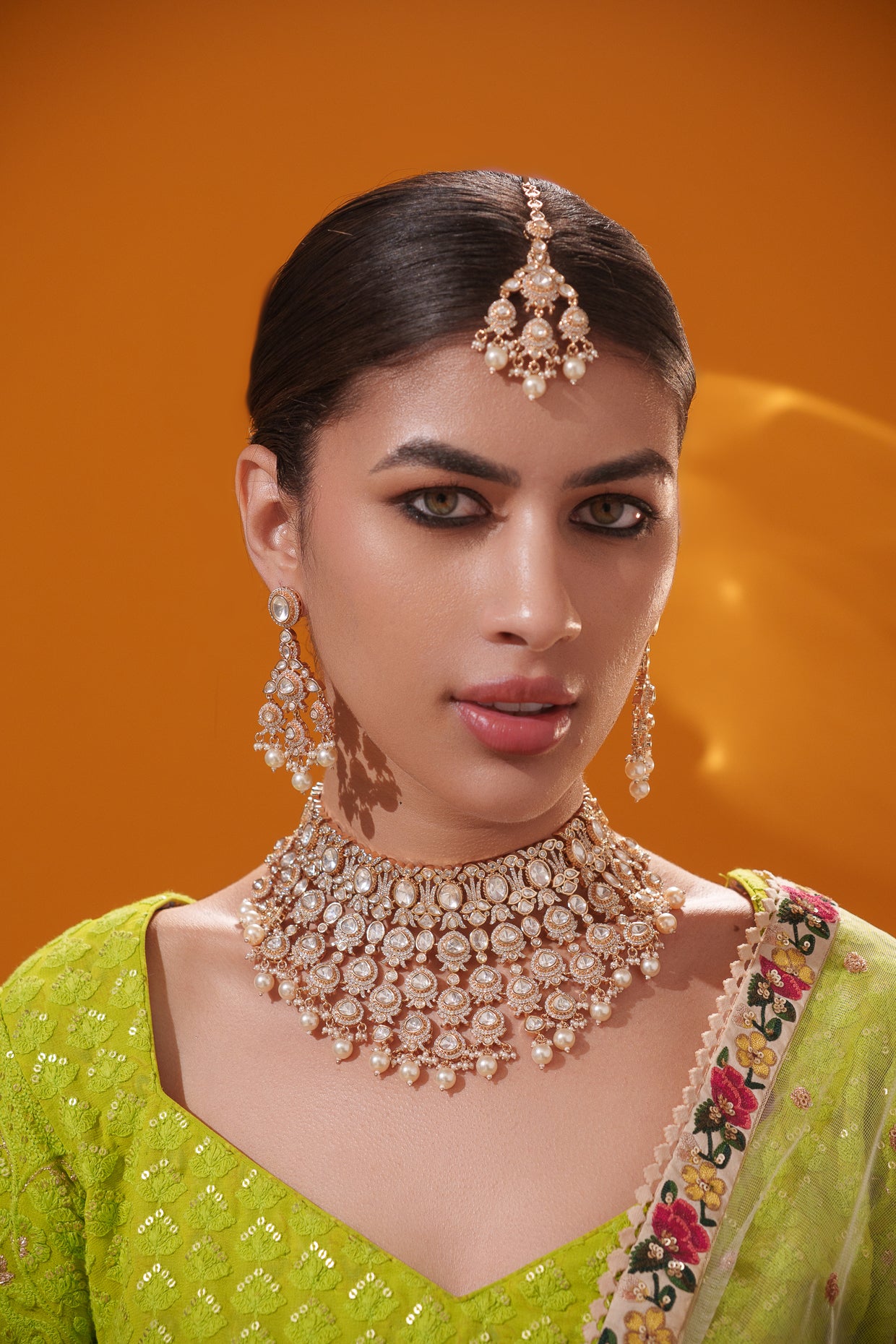 Traditional yet dramatic kundan necklace set with matching earrings and maangtika