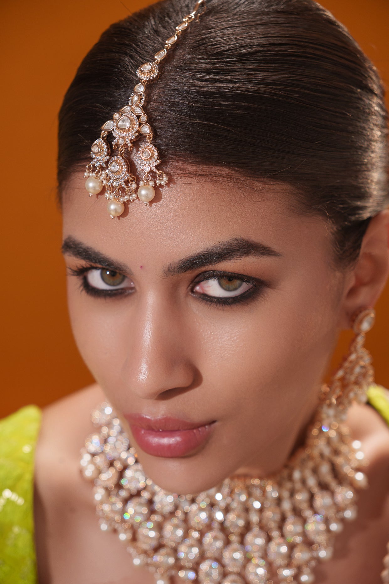 Traditional yet dramatic kundan necklace set with matching earrings and maangtika