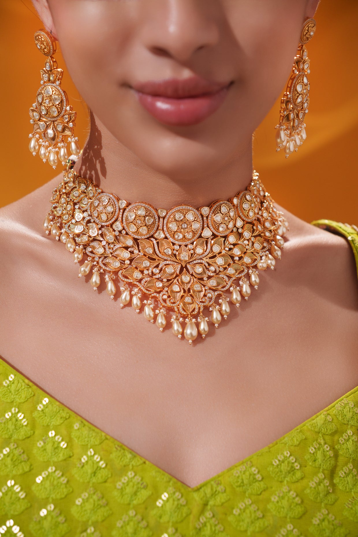 Traditional yet dramatic kundan necklace set with matching earrings and maangtika