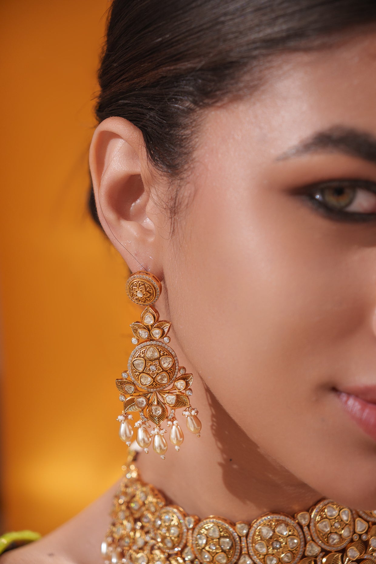 Traditional yet dramatic kundan necklace set with matching earrings and maangtika