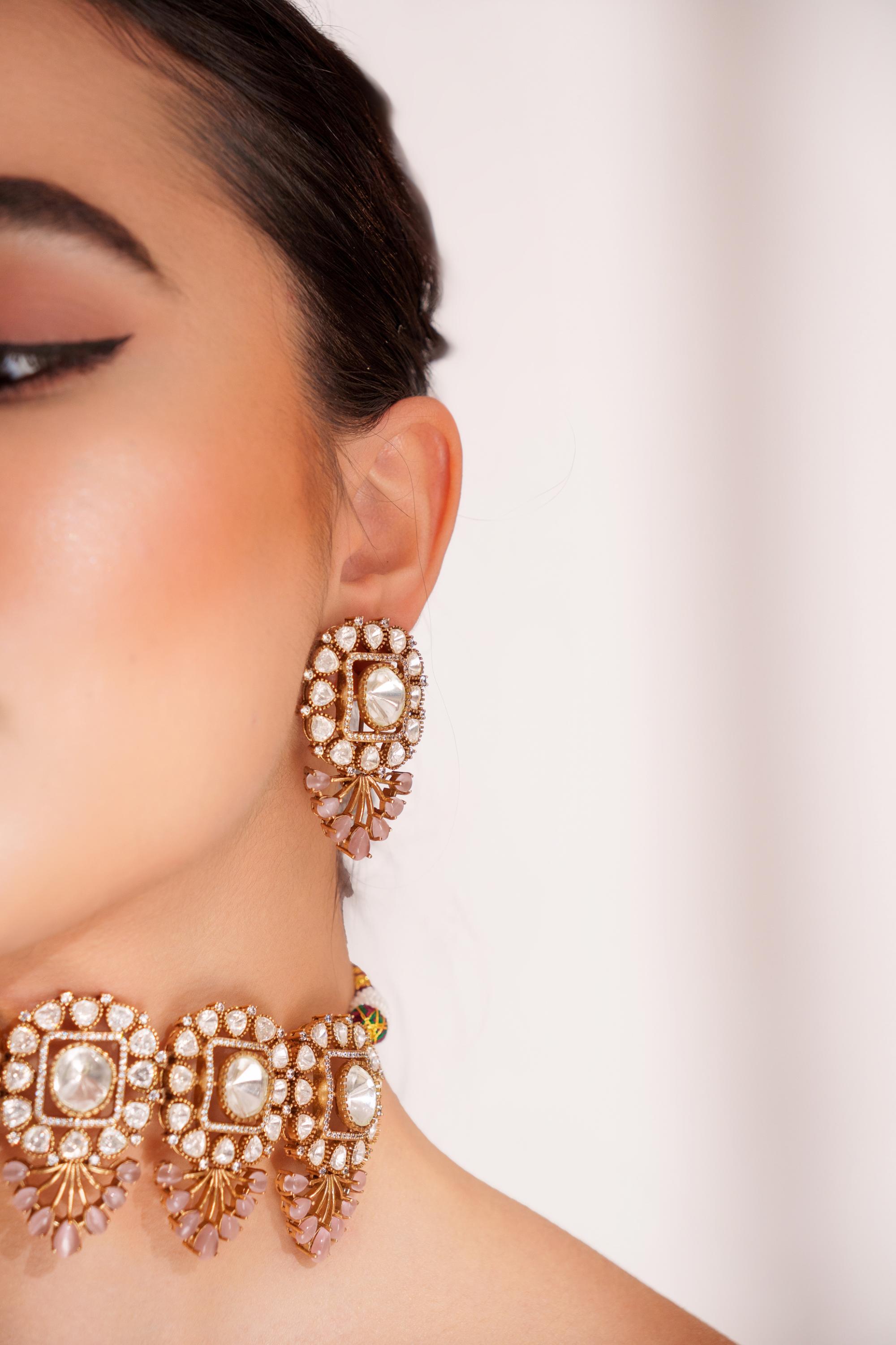 Bold and dramatic two tone finish polki choker set