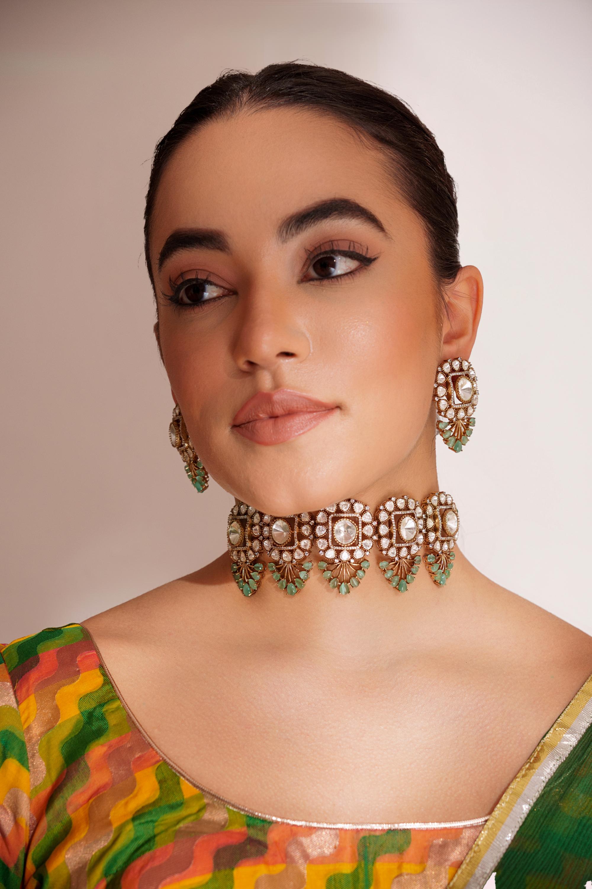 Bold and dramatic two tone finish polki choker set