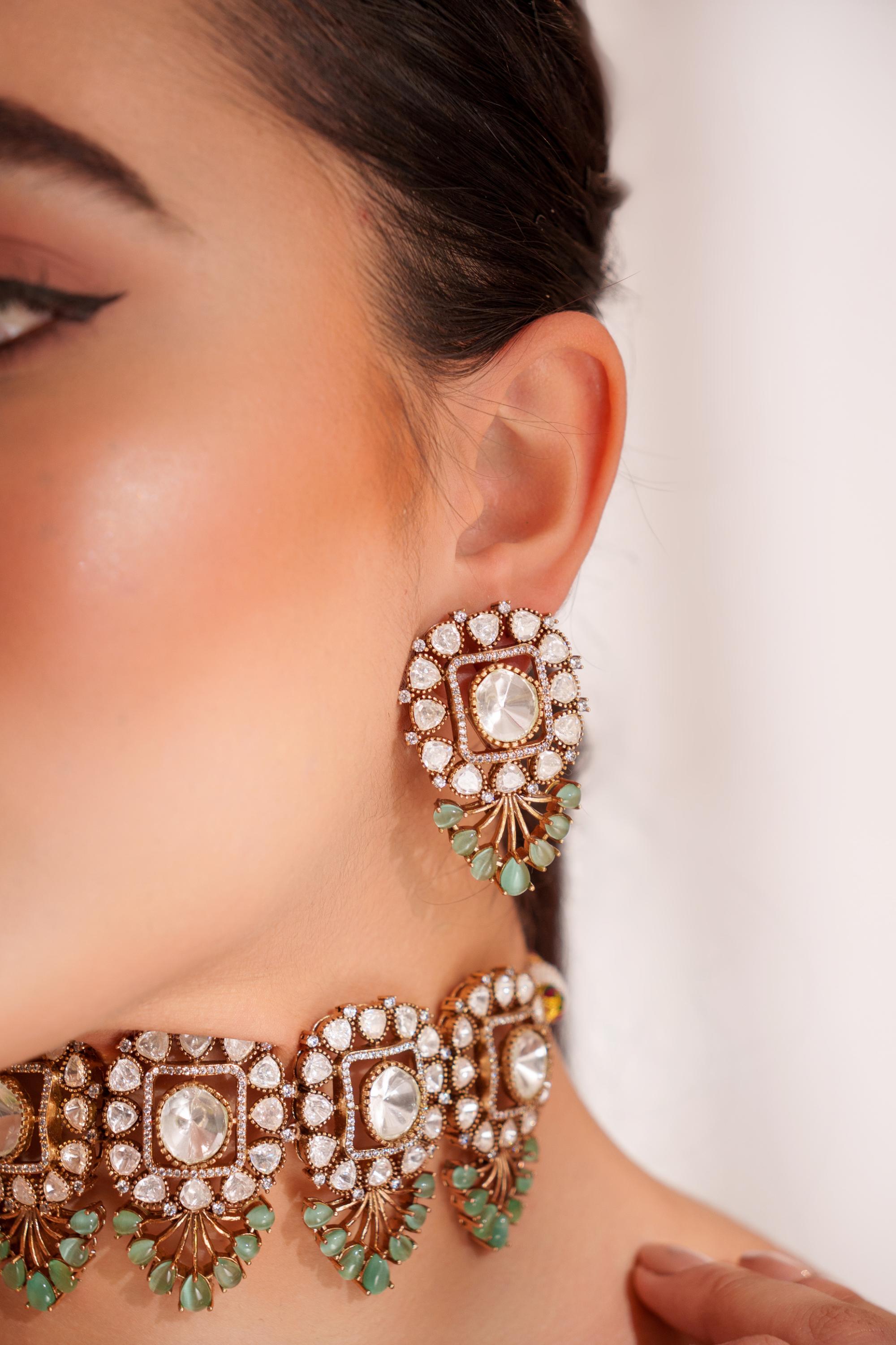 Bold and dramatic two tone finish polki choker set