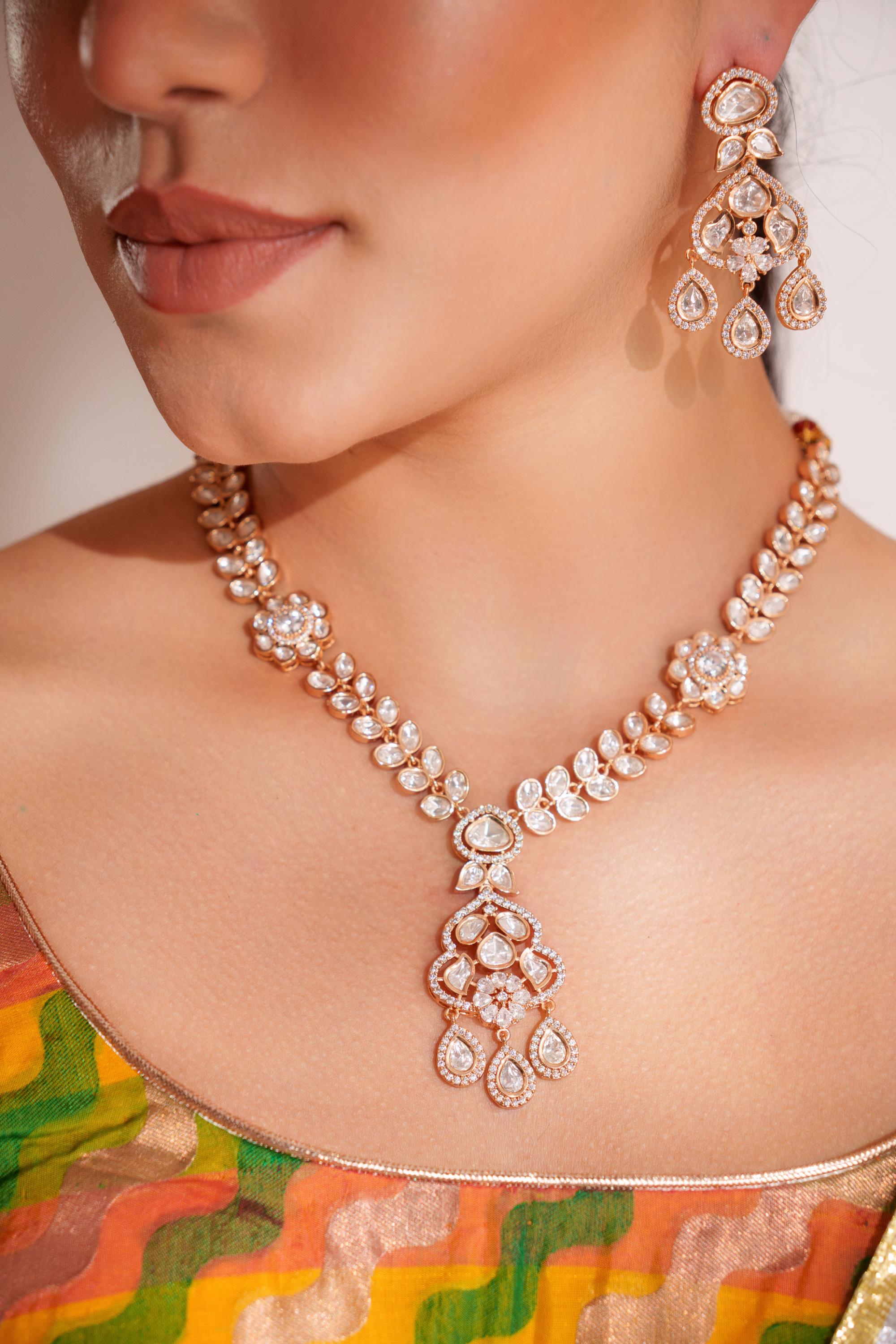 Bold and dramatic kundan long pendant necklace with elegant earrings