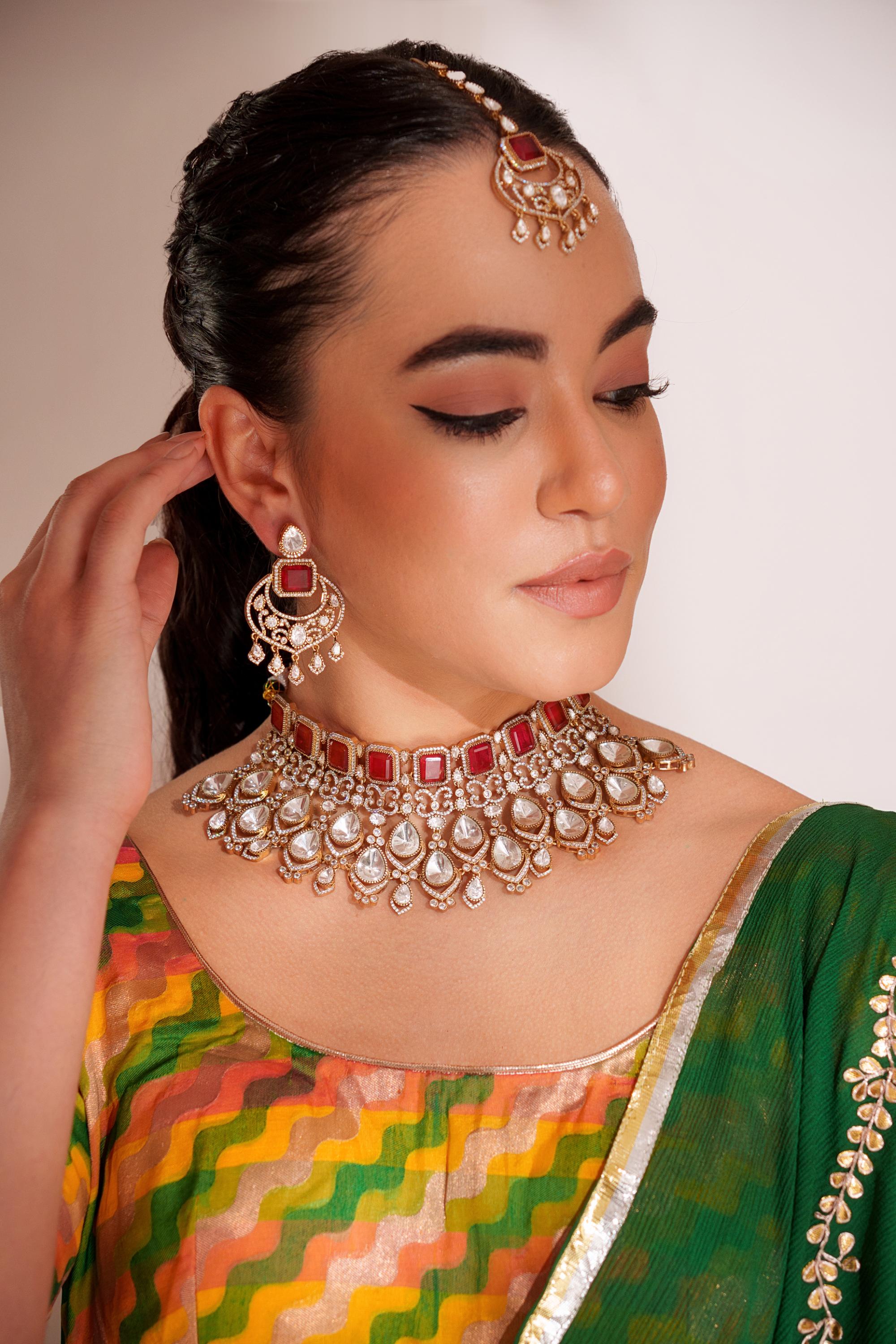 Bold and dramatic kundan necklace with earrings and maangtikka