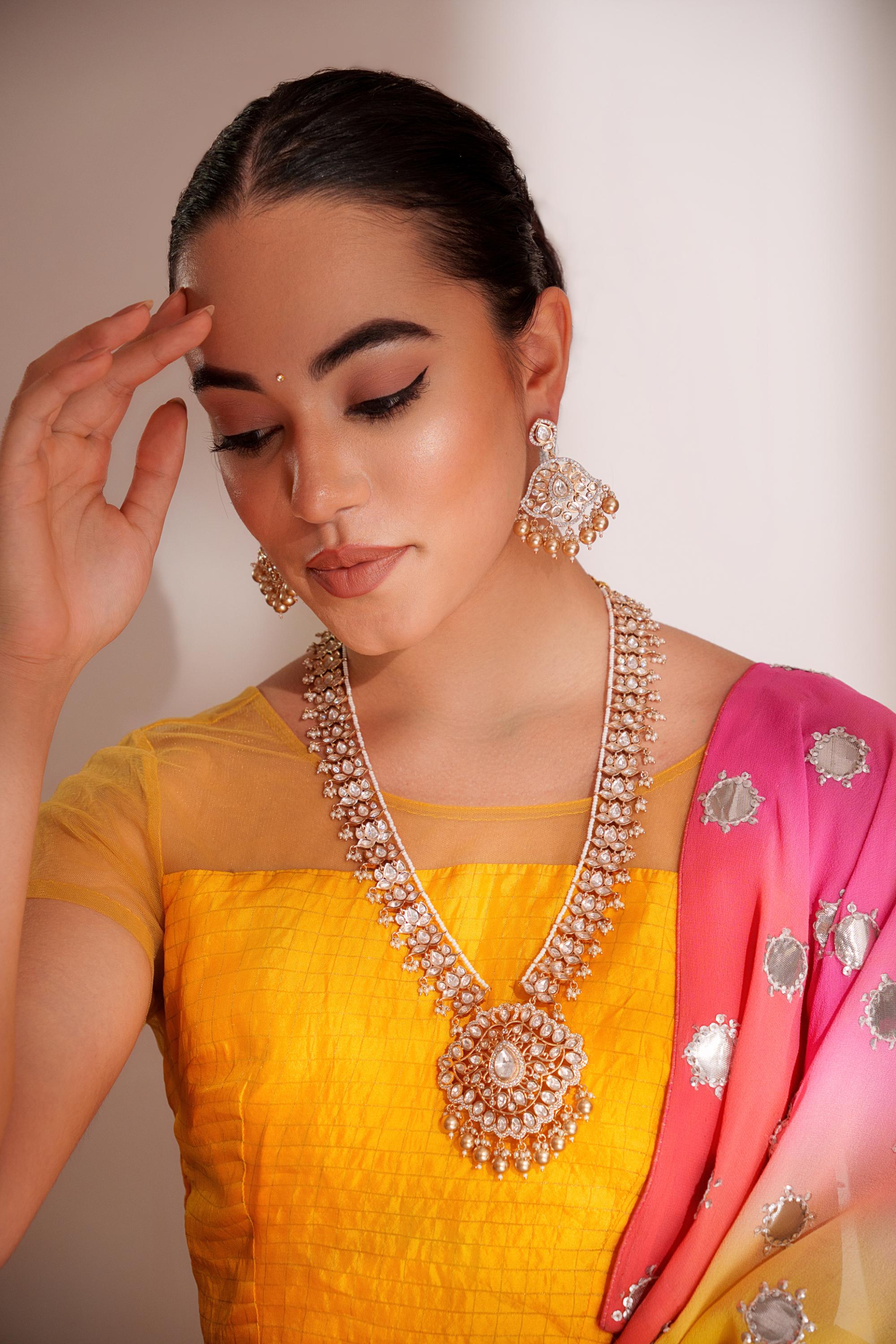 Bold and dramatic kundan long pendant necklace with elegant earrings