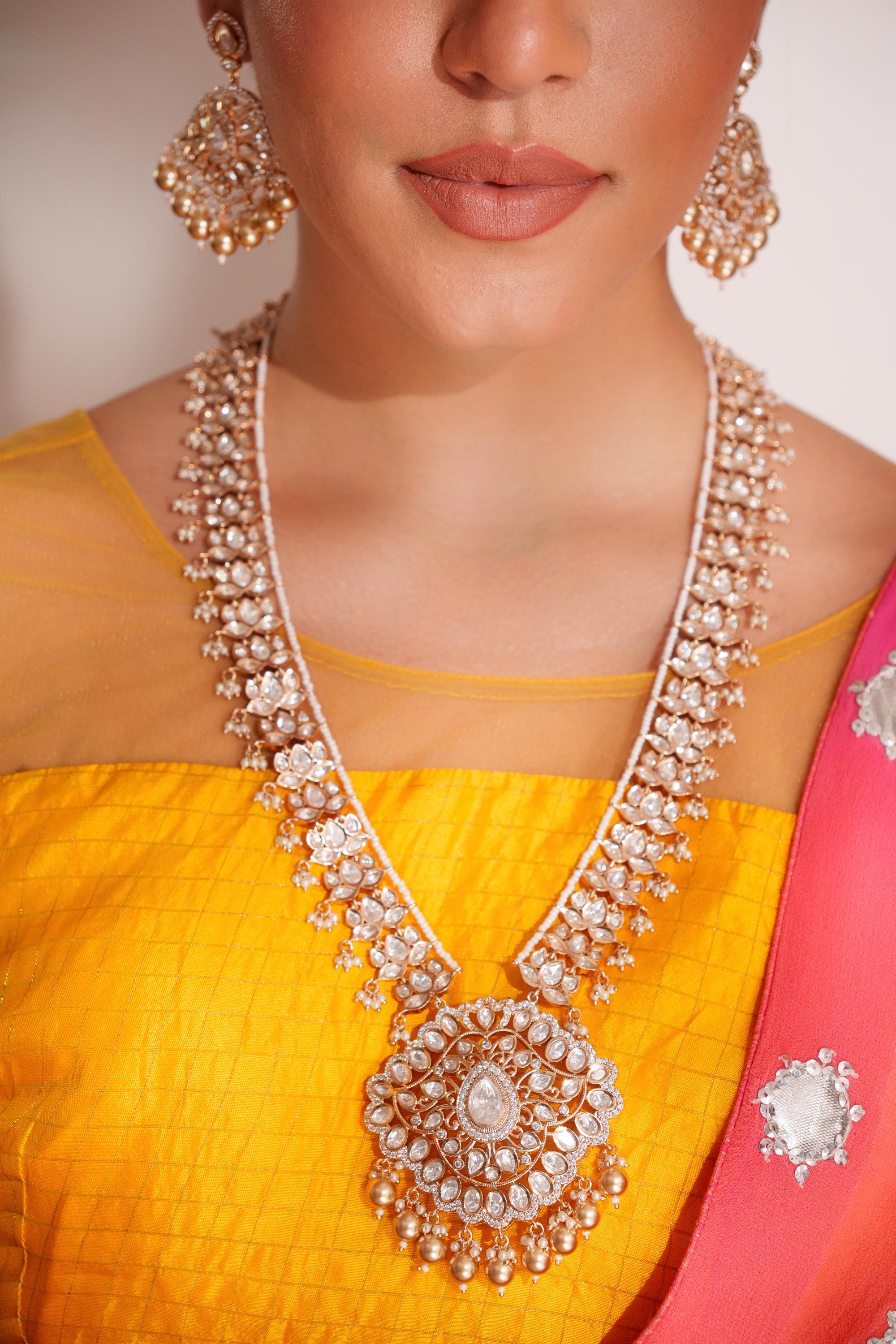 Bold and dramatic kundan long pendant necklace with elegant earrings