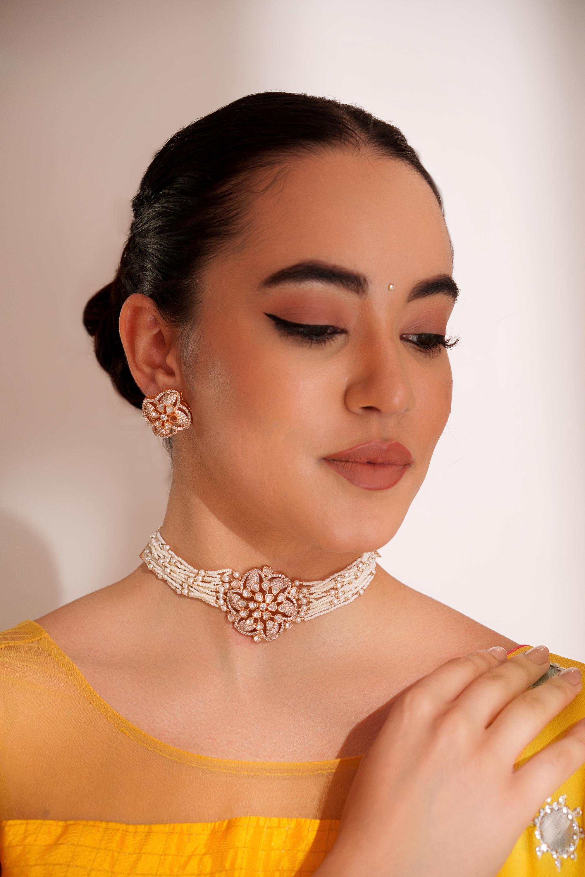 Classy kundan choker set with elegant pair of earrings.