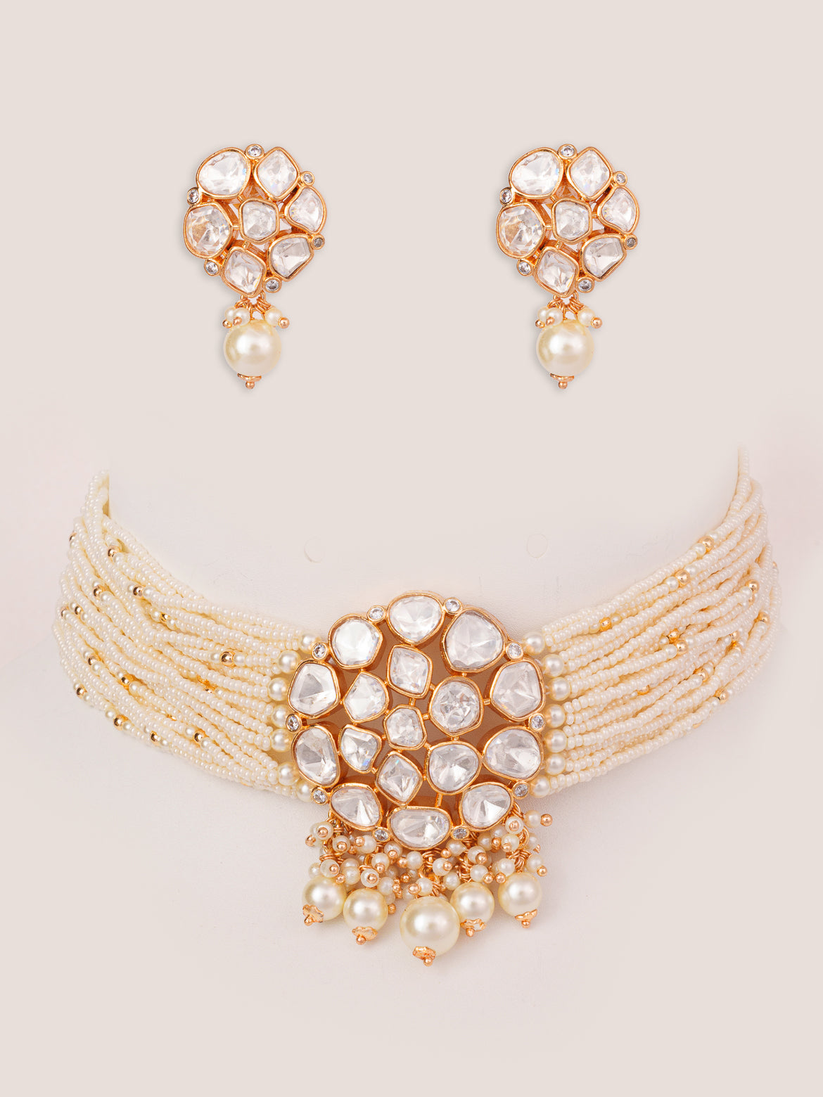 Classy kundan choker set with elegant pair of earrings.
